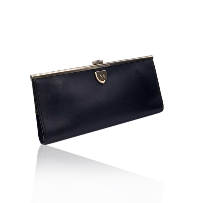 Vintage CHRISTIAN DIOR black leather clutch bag. Gold metal Dior logo tab on the front. Framed top with clasp closure on top.Black leather lining. 'Christian Dior - made in France' embossed inside.

Details

MATERIAL: Leather

COLOR: Black

MODEL:
