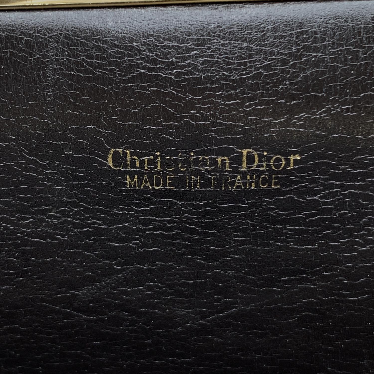 Christian Dior Vintage foldable clutch bag. Crafted in brown oblique logo tapestry canvas with brown leather trim. Button closure on the front when it is fold. Multi-purpose design since this can be folded and carried as a clutch, or opened and used
