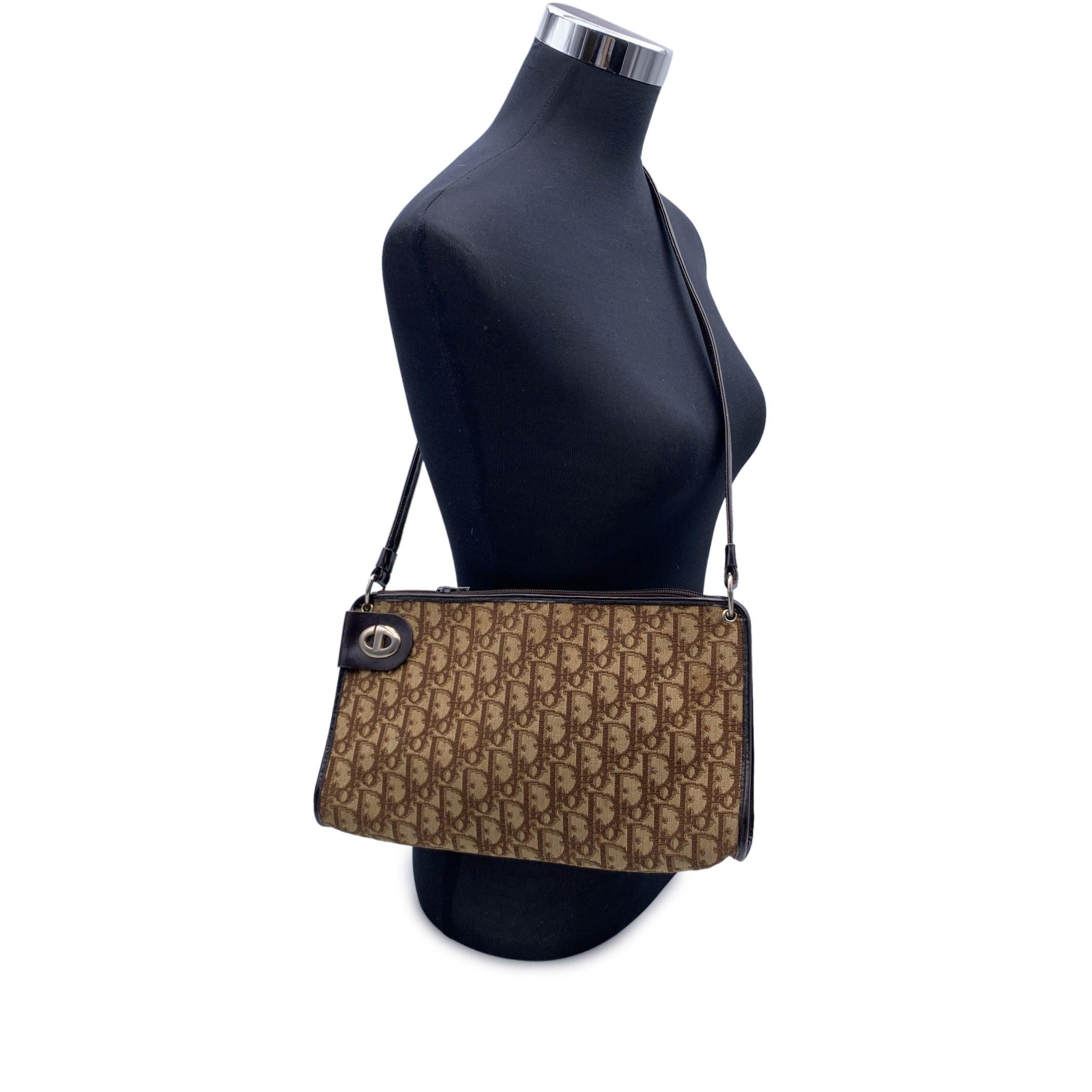 Vintage CHRISTIAN DIOR shoulder bag crafted in brown monogram oblique canvas with brown genuine leather trim. Upper zipper closure. Brown leather lining. 'Christian Dior - Made in france' embossed inside. Condition B - VERY GOOD A light brown stains
