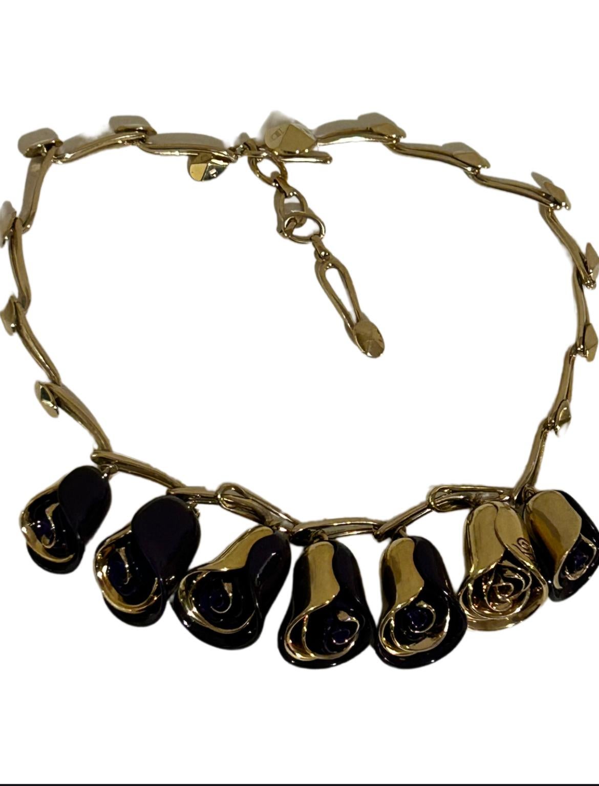 Here for you is this splendid vintage rose bud flower necklace by Christian Dior.

It's a very unusual piece, and I've not seen another like this.

With its beautiful purple enamel and gold metal designed as rose bud flowers this is a unique piece