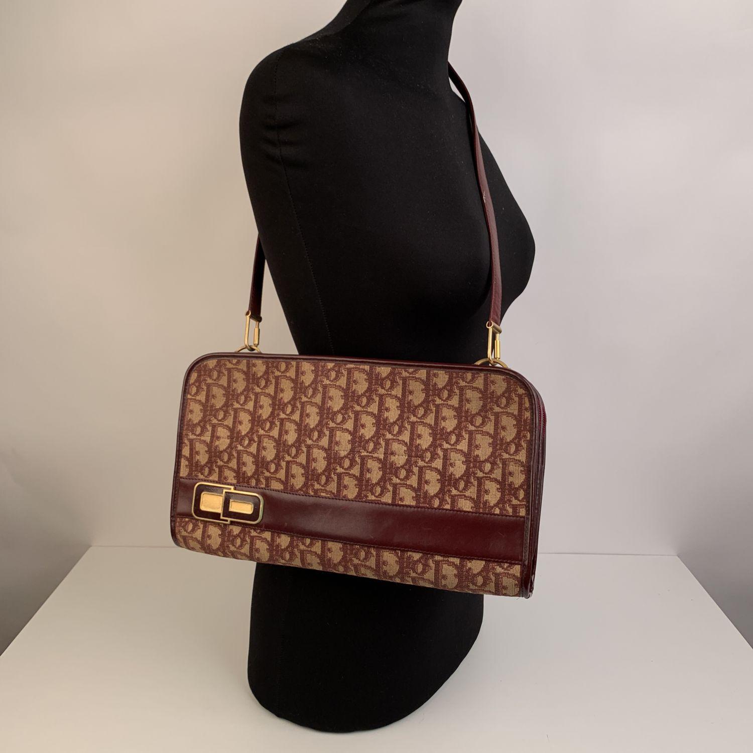 CHRISTIAN DIOR Vintage burgundy monogram tapestry canvas shoulder bag. Genuine leather trim. 2 main compartments with upper zipper closure. Leather lining. 'Christian Dior - made in France' embossed inside. Removable shoulder