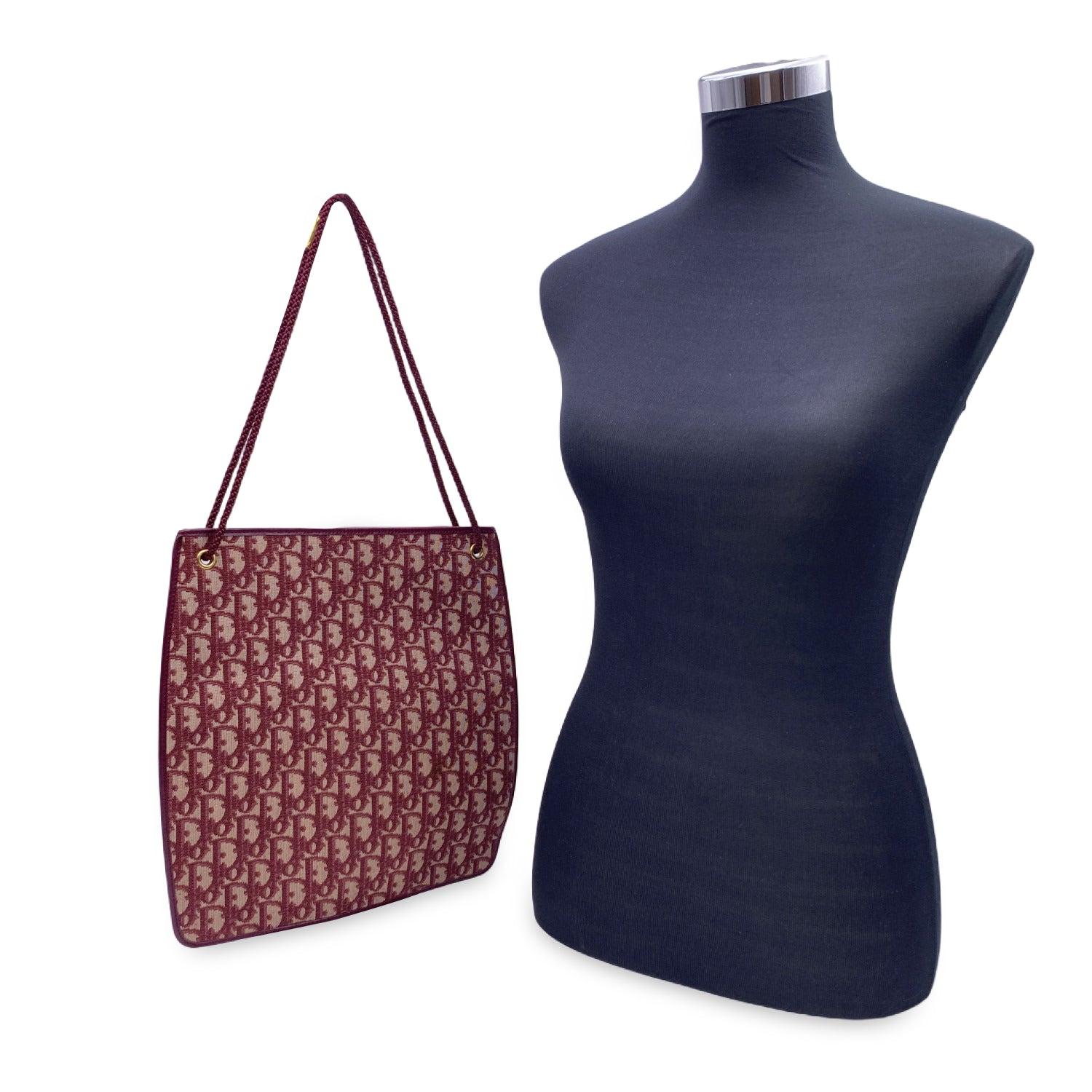 Christian Dior - Made in France' embossed inside, internal leather lining. Condition A - EXCELLENT Gently used. As seen in pictures. Details MATERIAL: Cloth COLOR: Burgundy MODEL: Oblique Vintage GENDER: Women COUNTRY OF MANUFACTURE: France SIZE: