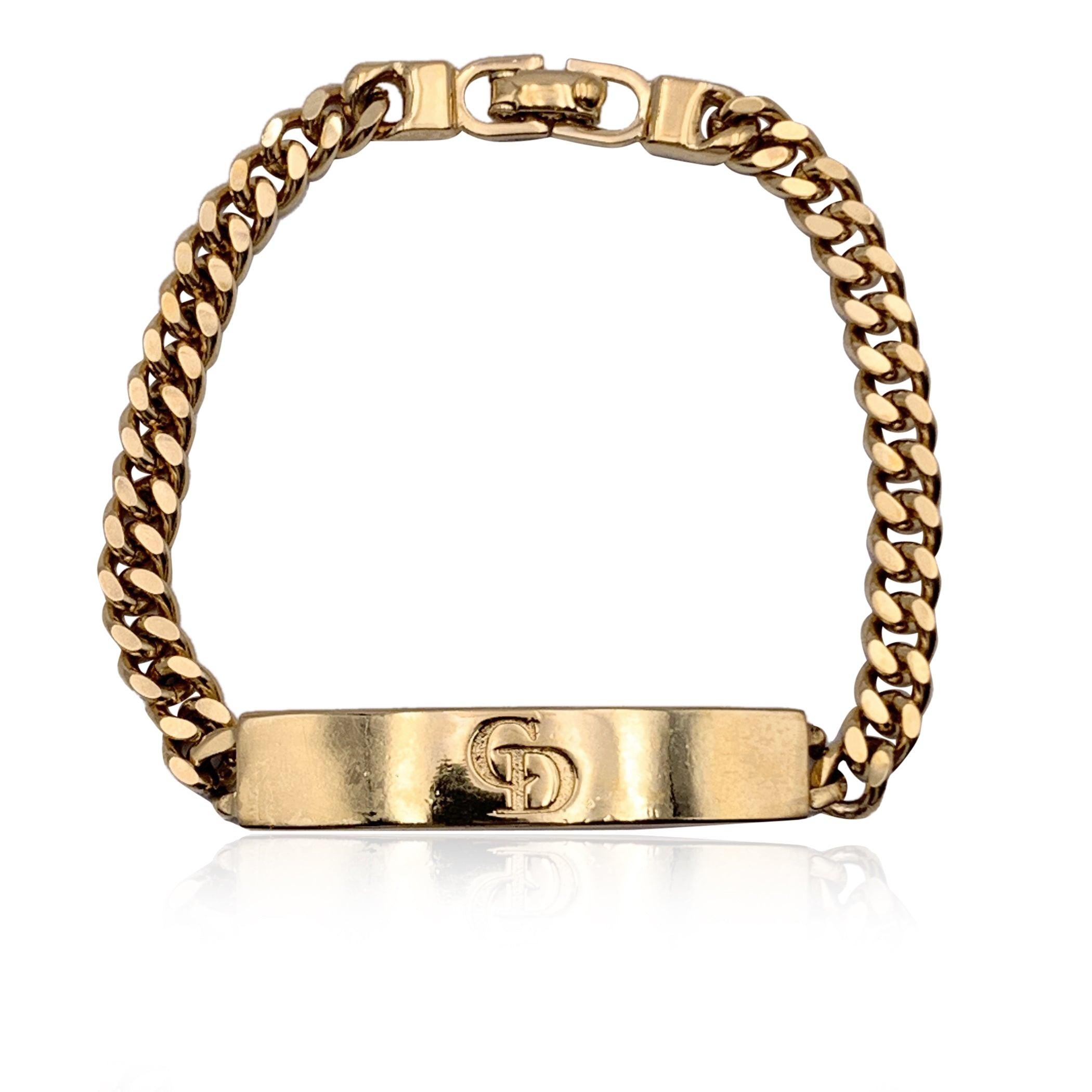 Vintage gold metal chain bracelet by CHRISTIAN DIOR. Gold metal plate with CD logo in the center. Clasp closure. Total length: 7 inches - 17.8 cm. 'Chr. Dior' embossed on the reverse of the bracelet Condition A - EXCELLENT Gently used. Please check
