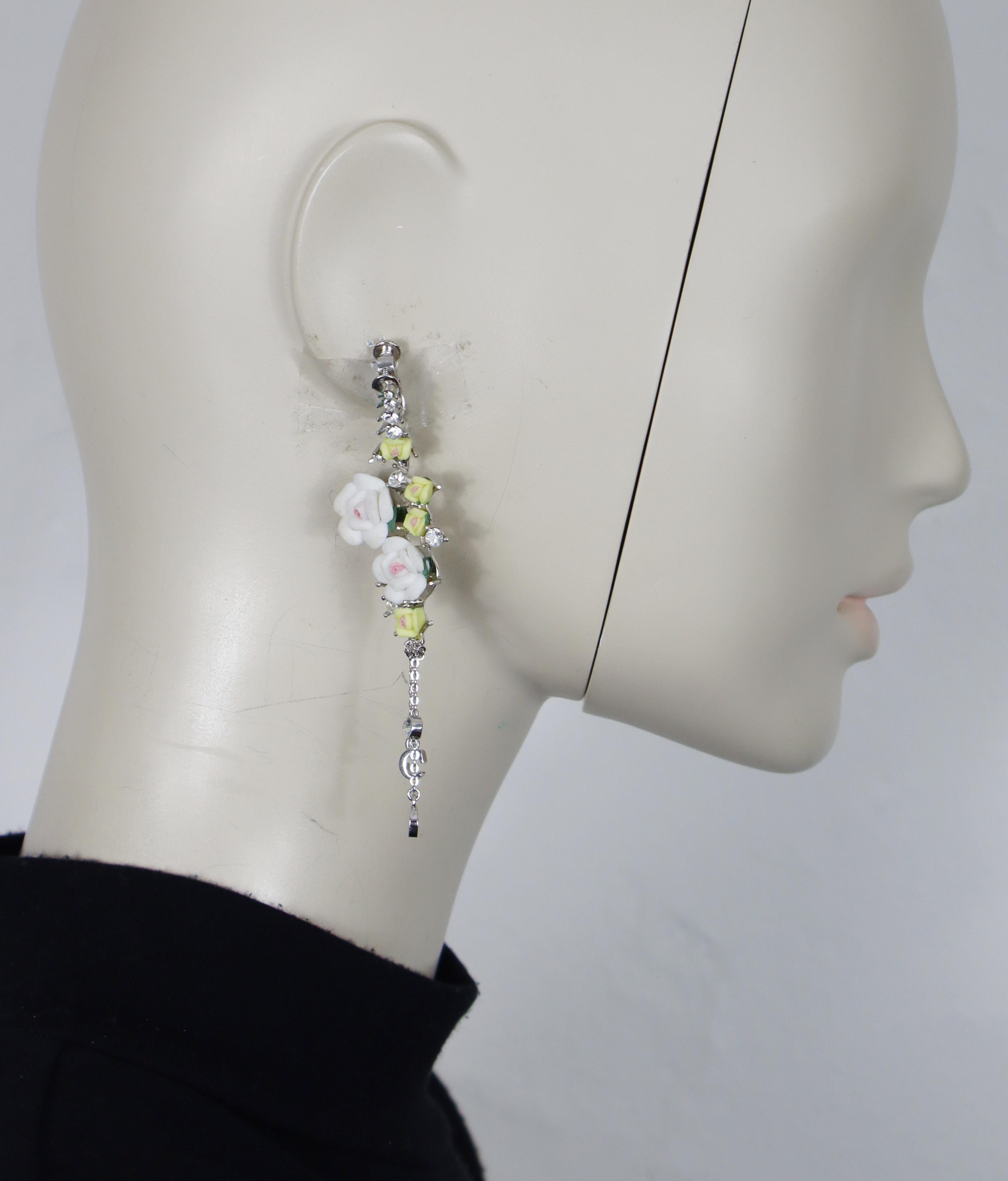 CHRISTIAN DIOR vintage silver tone dangle earrings (clip-on with screw system), embellished with clear crystals, featuring pastel colour roses with dangling C and D letters.

Unmarked.

Indicative measurements : max. height approx. 9 cm (3.54