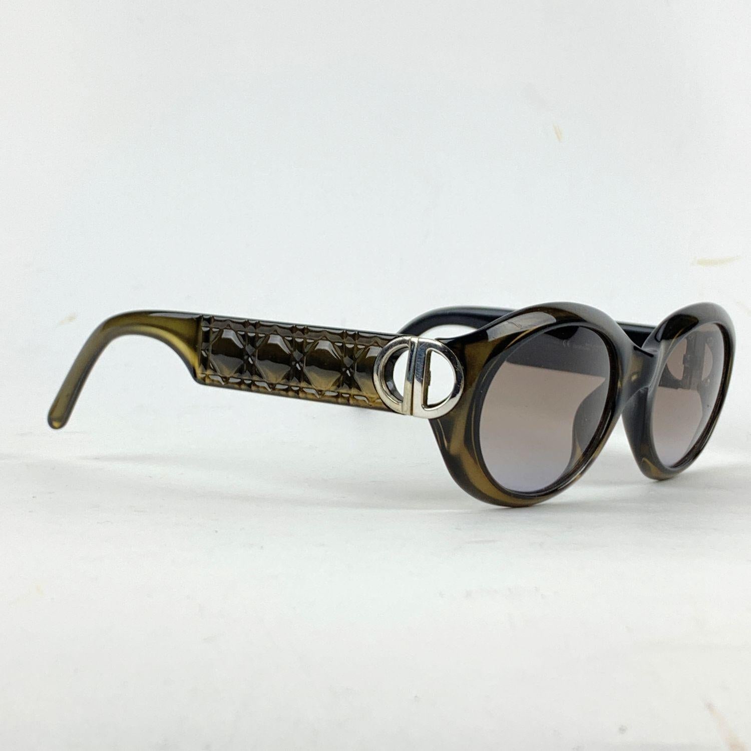 Beautiful Sunglasses designed by Christian Dior in brown/miltary green tone color. Acetate oval OPTYL frame with cannage pattern on the ear stems and silver metal CD logo on temple. High quality original lenses, 100% UV 3 protection. Mod. and Refs: