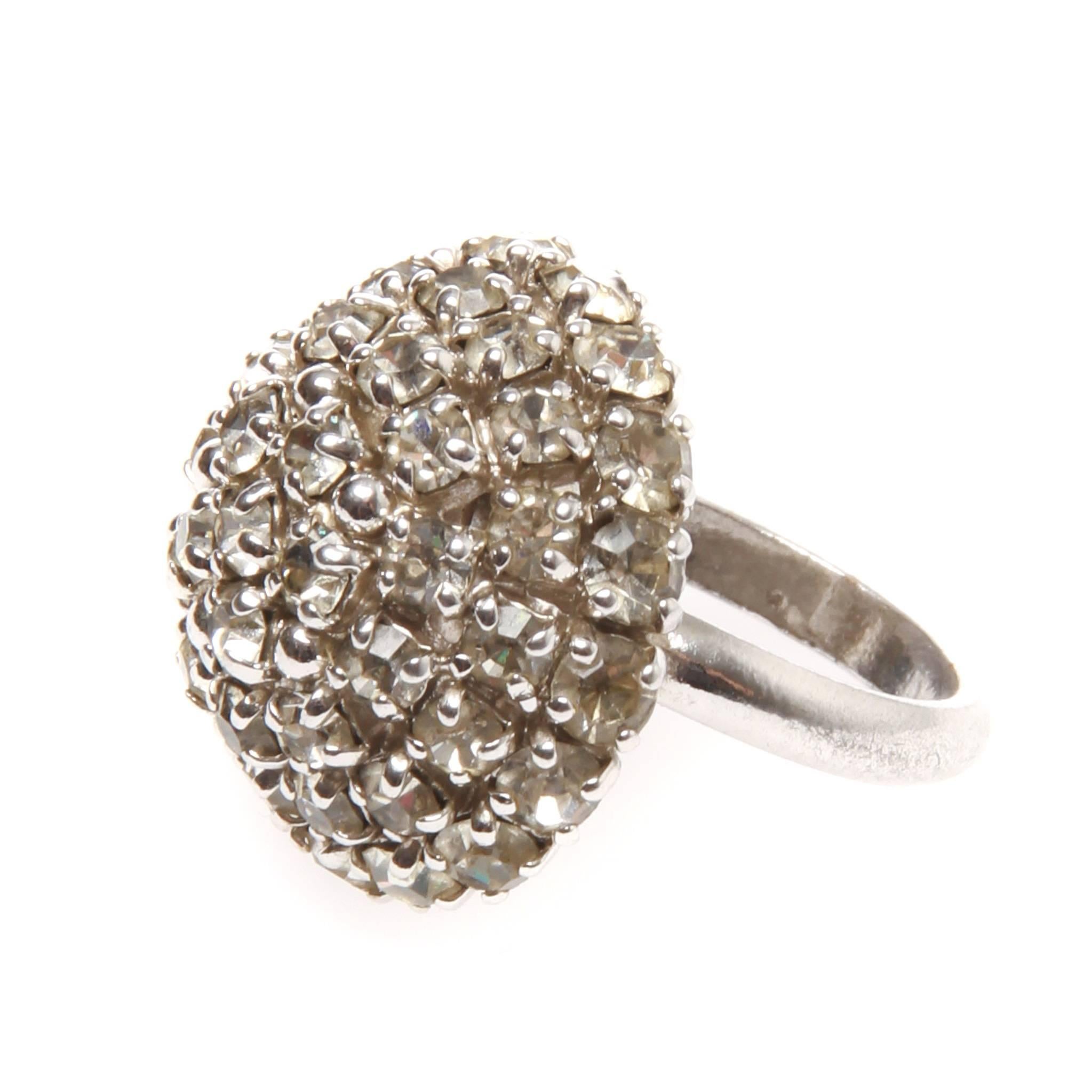 A collectable vintage massive crystal rhinestone dome cocktail ring by CHRISTIAN DIOR. Made in the 1970's

Intricately crafted with round crystal rhinestones are arranged in a dimensional dome shape and are all prong set.
It is signed 