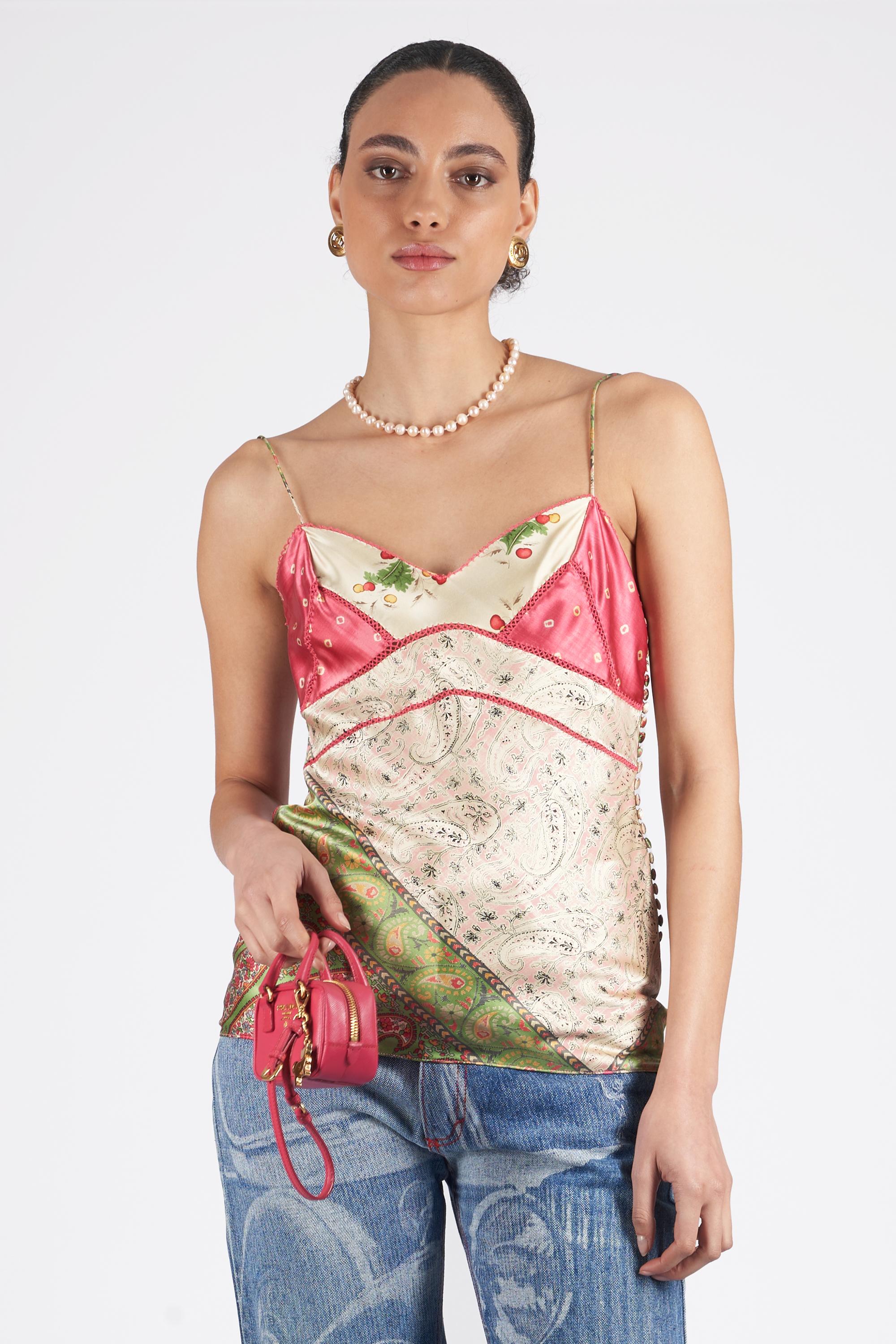 John Galliano for Christian Dior Fall Winter 2003 silk cami top. Features spaghetti straps, floral patchwork pattern with coated side buttons and zip closure. Pre-loved, in excellent vintage condition.

Brand: Christian Dior
Size: UK 8
Color: