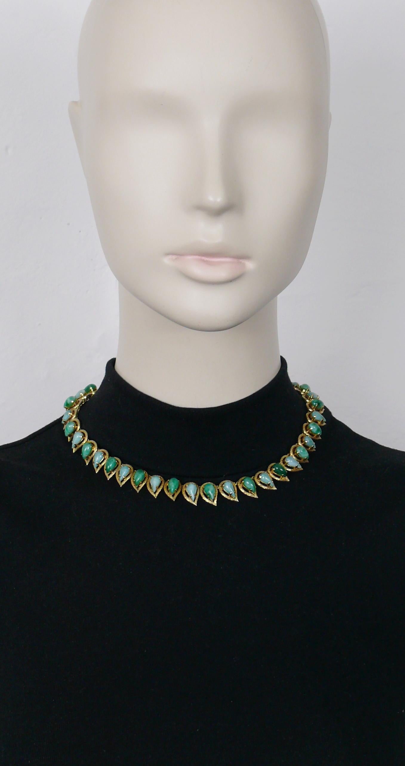 CHRISTIAN DIOR vintage gold toned articulated necklace embellished with faux jade pear-shaped glass stones.

Hidden push button closure.

Embossed CHR. DIOR 1965 © Germany.

Indicative measurements : length approx. 39 cm (15.35 inches) / width