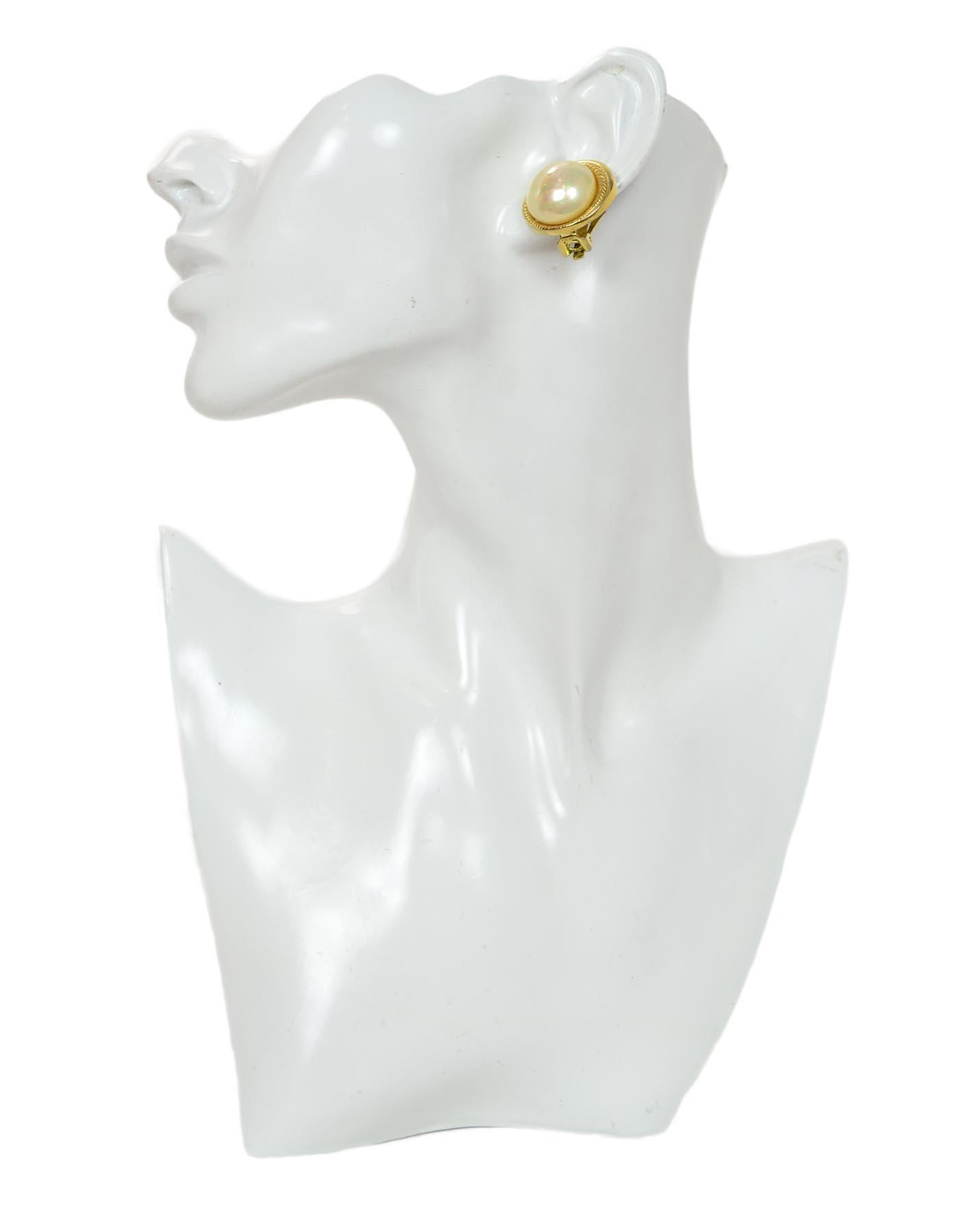 Christian Dior Vintage Gold Faux Pearl Clip On Earrings

Color: Gold, white
Materials:  Metal and faux pearl
Hallmarks:   On back of both earrings 