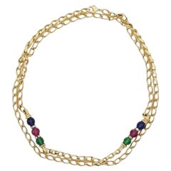 Christian Dior: collana lunga vintage in oro con perline Gripoix nei colori blu, rosso e verde intrecciati