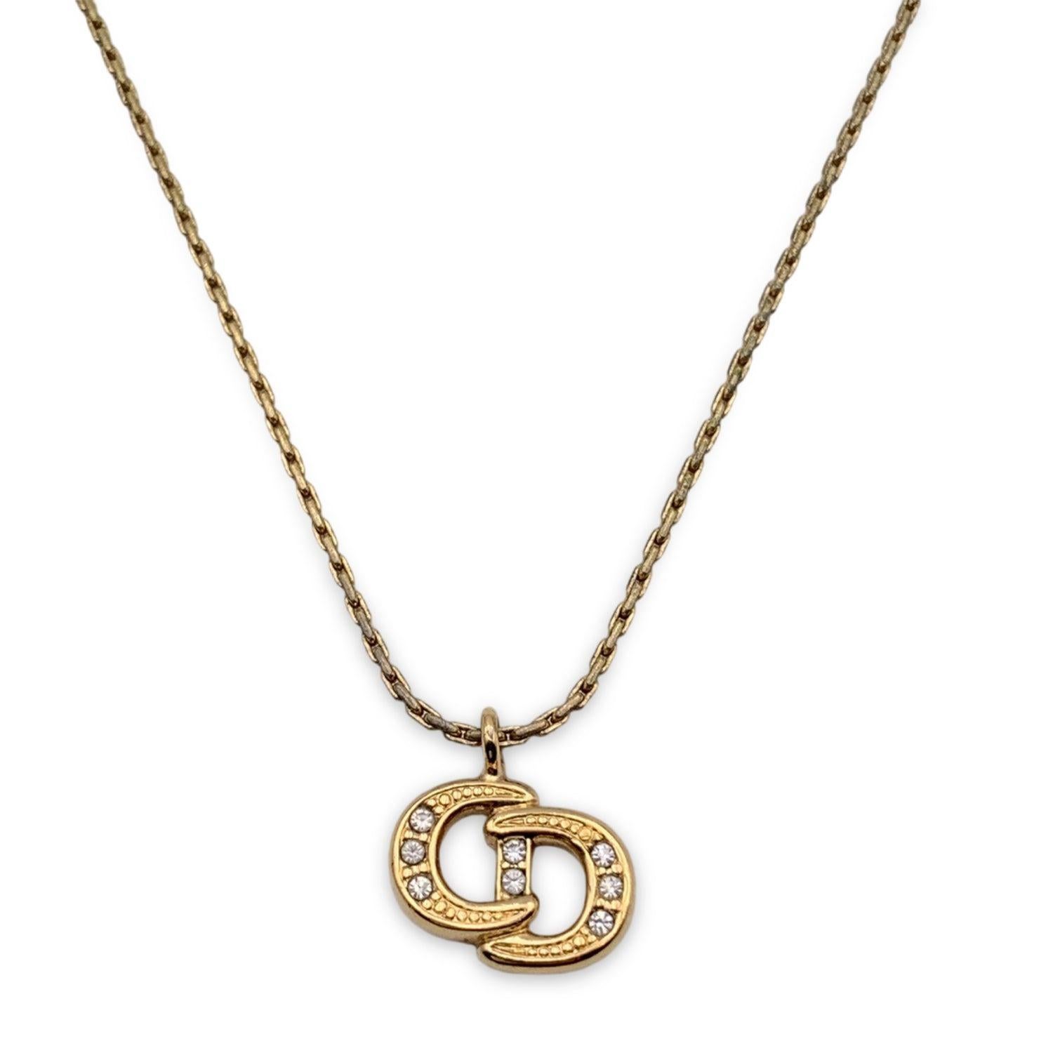 Vintage Christian Dior gold metal chain necklace with CD logo pendant, embellished with 6 small rhinestones. Spring ring closure. Small CD charm at the end of the necklace. Chain length: about 16.5 inches - 42 cm Condition A - EXCELLENT Gently used.