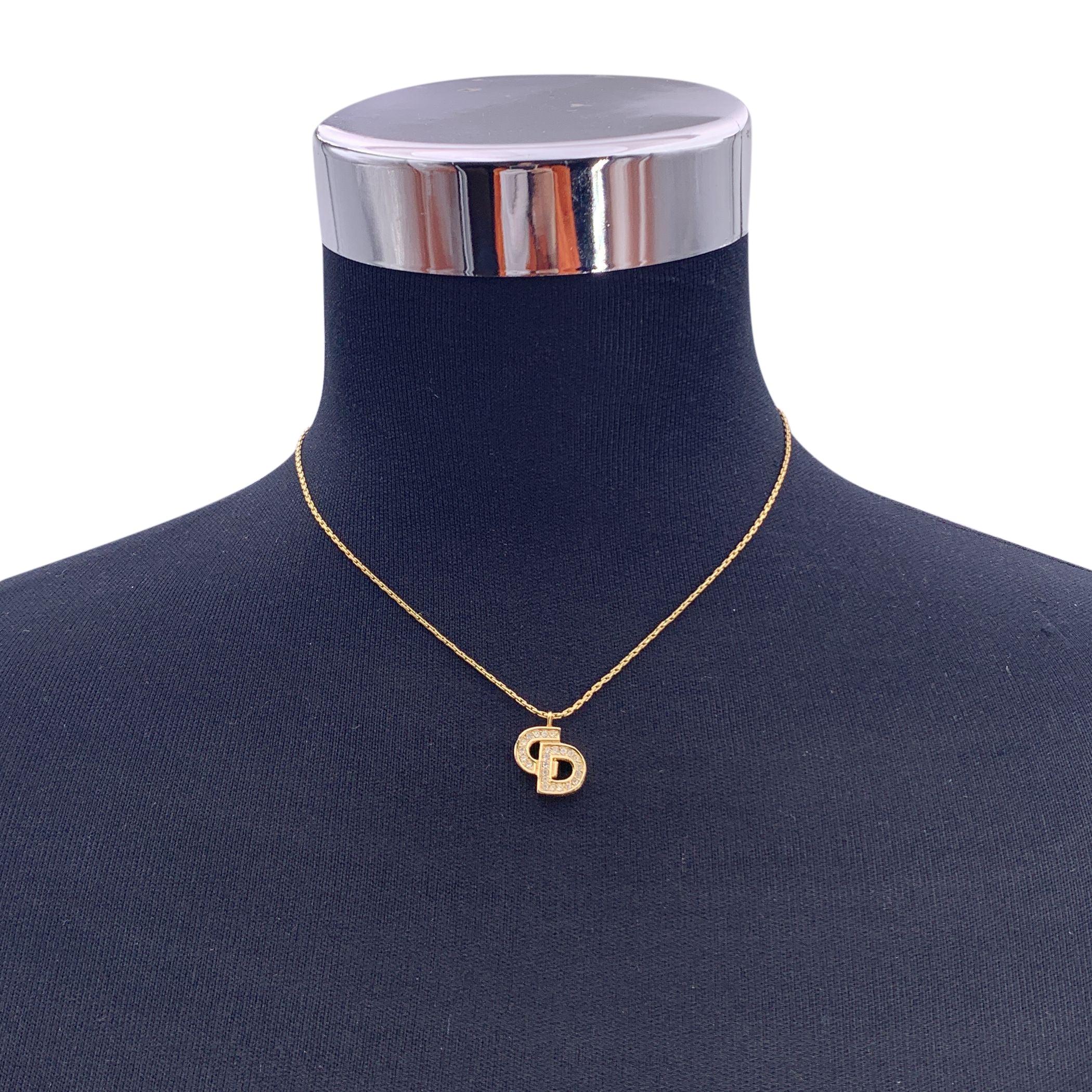 Vintage Christian Dior gold metal chain necklace with CD logo pendant, embellished with 6 small rhinestones. Spring ring closure. Small CD charm at the end of the necklace. Chain length: about 14.5 inches - 36.8 cm. Made in Germany Condition A -