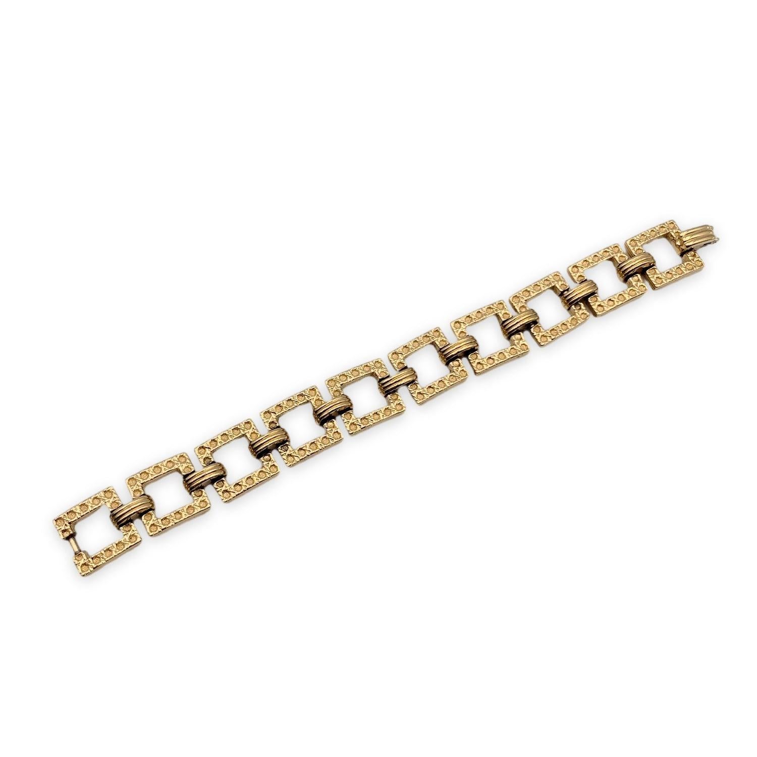 Gold metal articulated vintage bracelet by CHRISTIAN DIOR. Square links. Internal circumference: 7 inches - 17.8 cm. 'Dior' signature engraved on the reverse of the bracelet. Condition A - EXCELLENT Gently used. Please check pictures carefully and