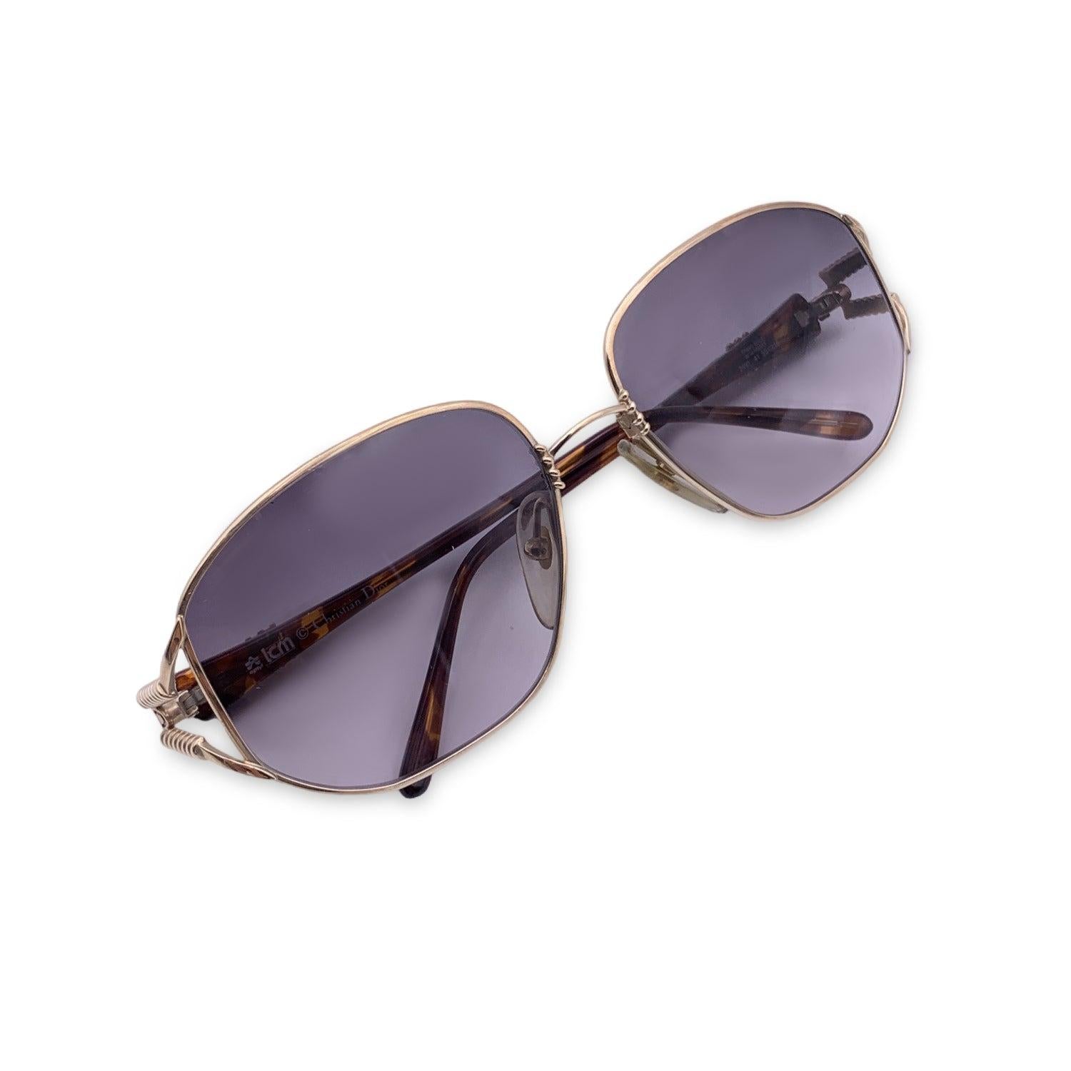 Vintage Christian Dior Women sunglasses, Mod. 2492 41 Optyl. Size: 55/16 120 mm. Gold metal frame with brown acetate temples. Oval design. 100% Total UVA/UVB protection gradient lenses in grey color. CD logo on temples. Details MATERIAL: Metal