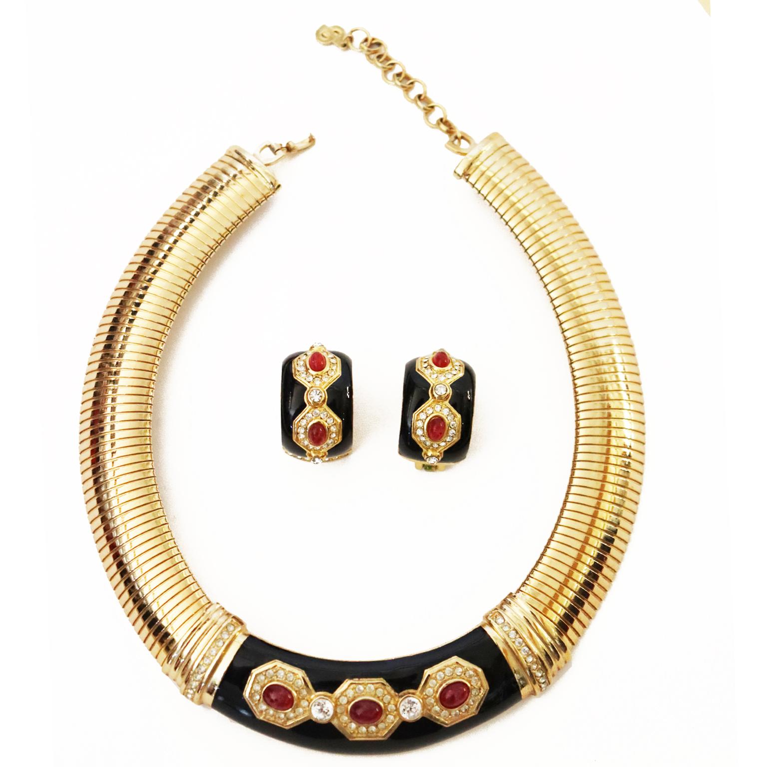 This gorgeous vintage Christian Dior jewelry set includes an omega gold plated collar necklace with black enamel, crystals and carnelian like stones and the matching clip earrings.The earrings are 1