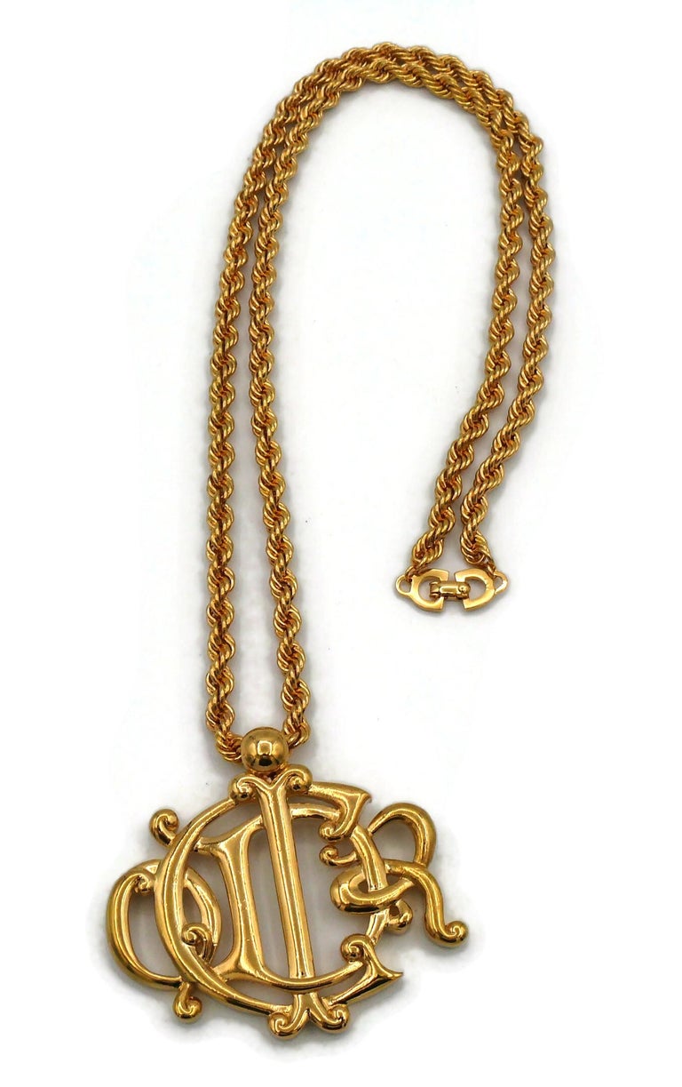CHRISTIAN DIOR Vintage Gold Tone Logo Pendant Necklace For Sale at 1stDibs