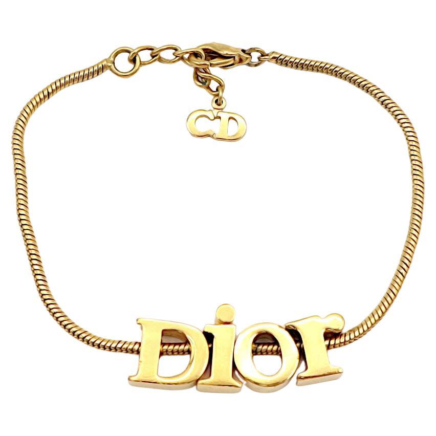 CHRISTIAN DIOR Vintage Gold Tone Spellout Bracelet For Sale