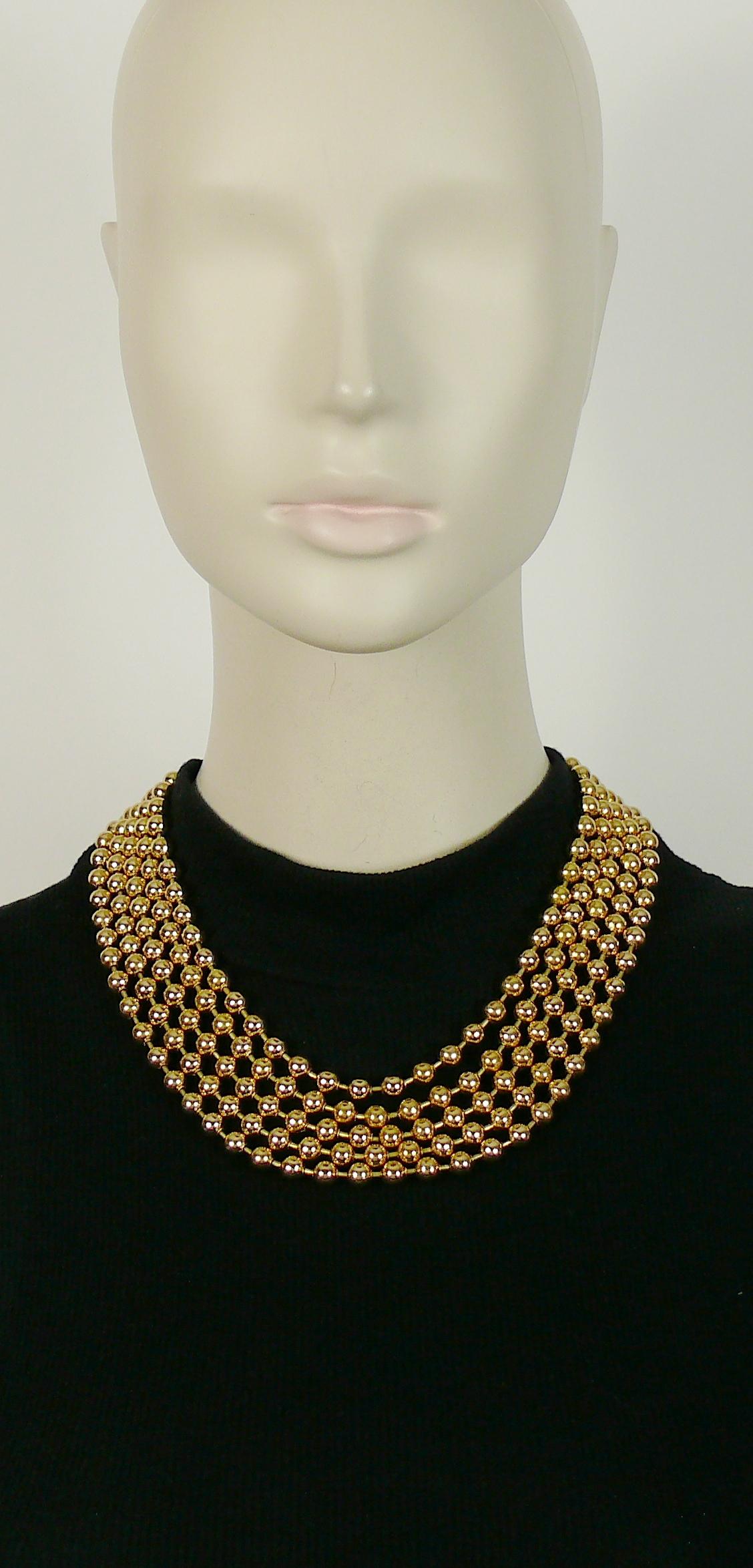 CHRISTIAN DIOR vintage multi strand gold toned metal pearls necklace.

T-bar and toggle closure.

Marked CHR. DIOR.

Indicative measurements : length approx. 46 cm (18.11 inches).

NOTES
- This is a preloved vintage item, therefore it might have