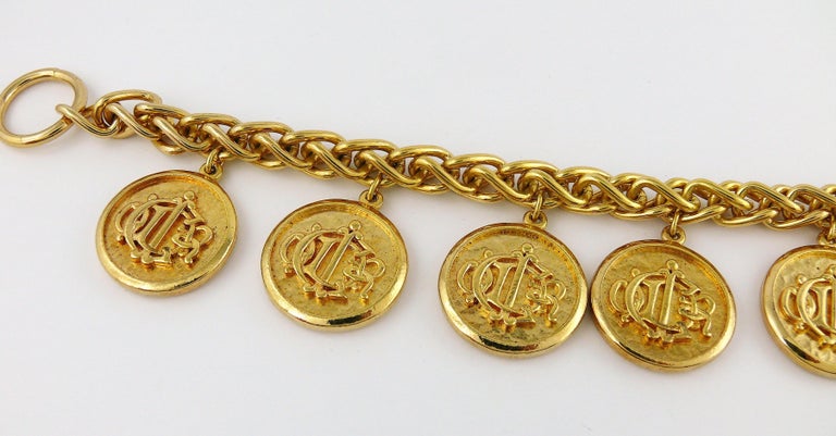 Christian Dior Vintage Gold Toned Signature Coin Charm Bracelet For Sale at 1stDibs