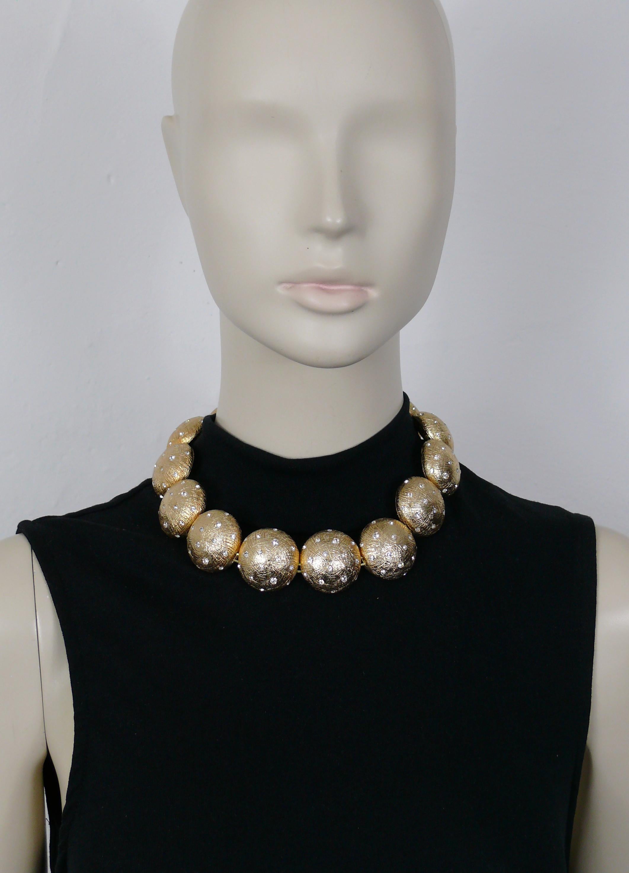 CHRISTIAN DIOR vintage starlight necklace featuring textured gold toned celestial dome links embellished with clear crystals simulating brighting stars.

Adjustable hook clasp closure.

Embossed CHR. DIOR Germany.

Indicative measurements :