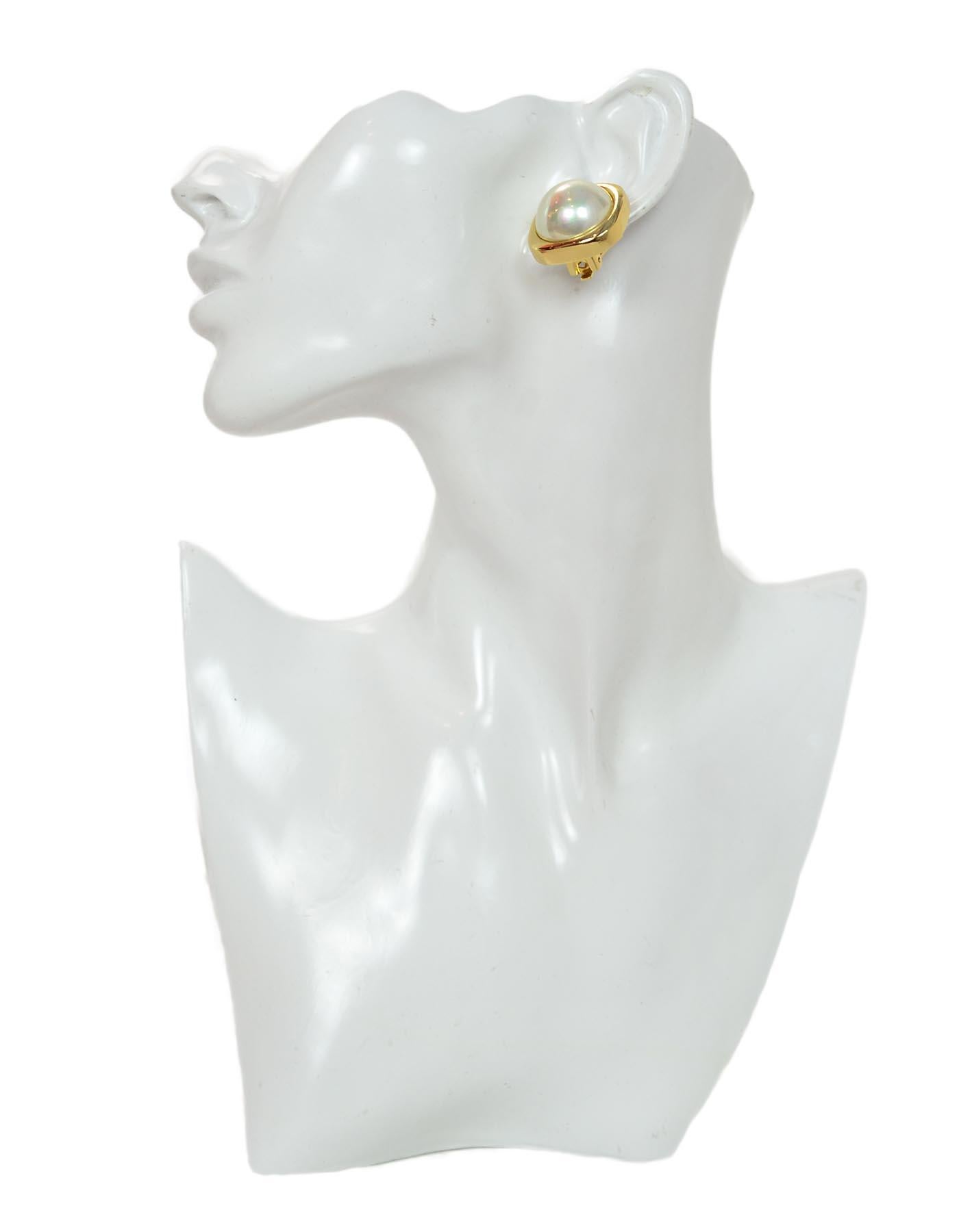 Christian Dior Vintage Goldtone Square Earrings W/ Center Faux Pearl

Color: Gold, white
Materials:  Metal, faux pearl
Hallmarks:  On back of both earrings 