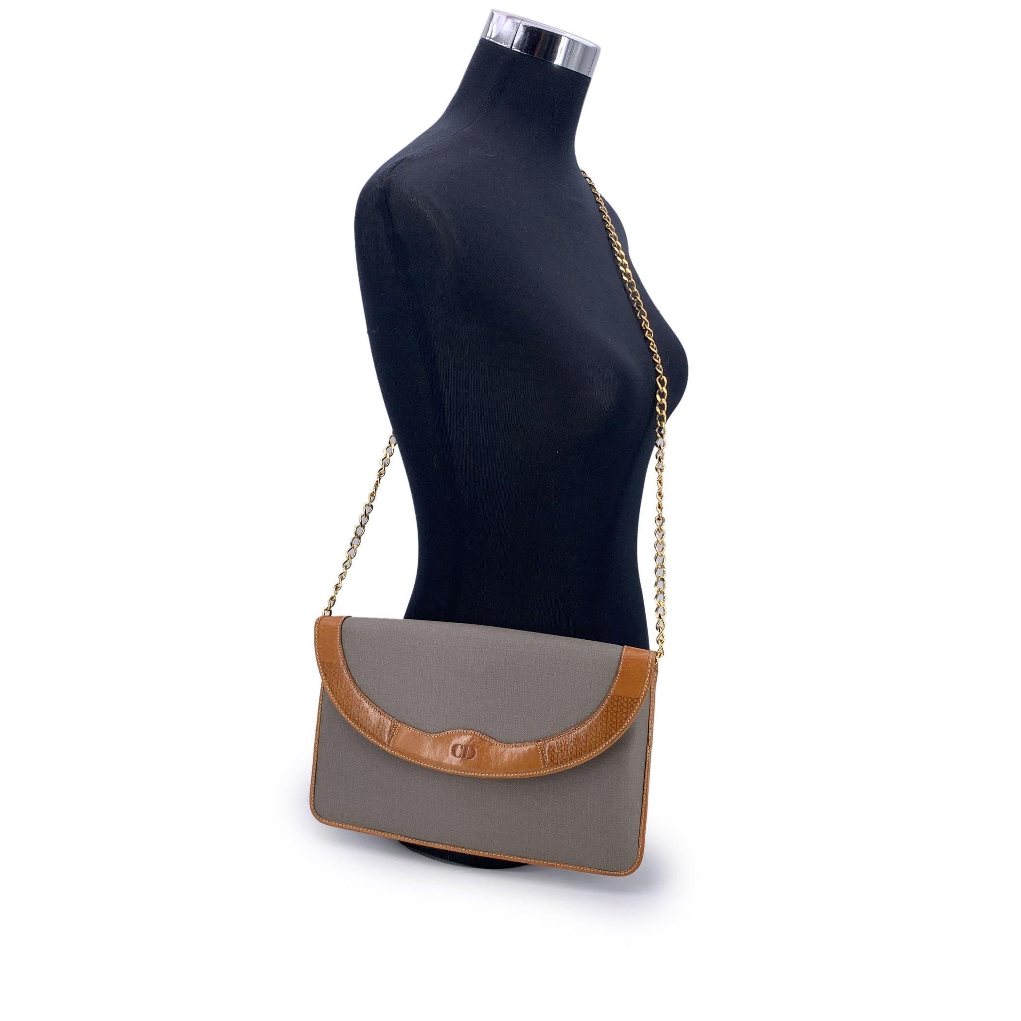 A timeless piece from the house of Dior, this vintage Christian Dior shoulder bag is a refined blend of Parisian elegance and understated luxury. Crafted in grey canvas with smooth beige leather trim, it carries the effortless charm of a bygone