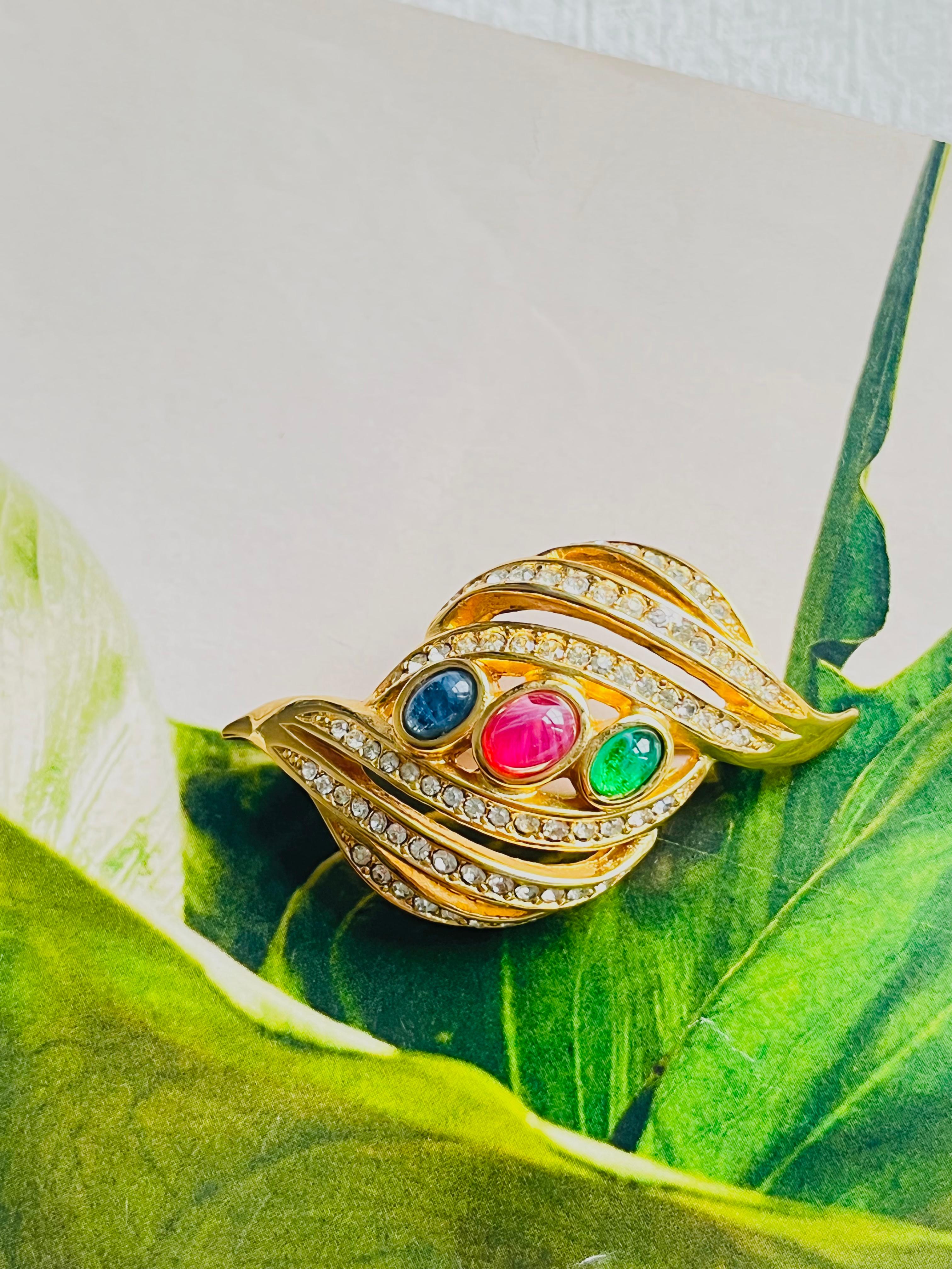 Christian Dior Vintage 1980s Gripoix Emerald Ruby Sapphire Shining Crystals Openwork Leaf Brooch, Gold Tone

Very good condition. Maybe light scratches or color loss, barely noticeable. Rare to find. 100% Genuine.

A unique piece. This is gold