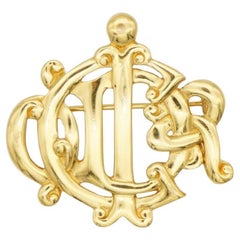 Christian Dior Vintage Iconic Gold Glow Interlocked Letters Logo Monogram Brooch