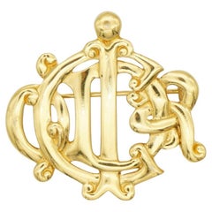 Christian Dior Vintage Iconic Gold Glow Interlocked Letters Logo Monogram Brooch