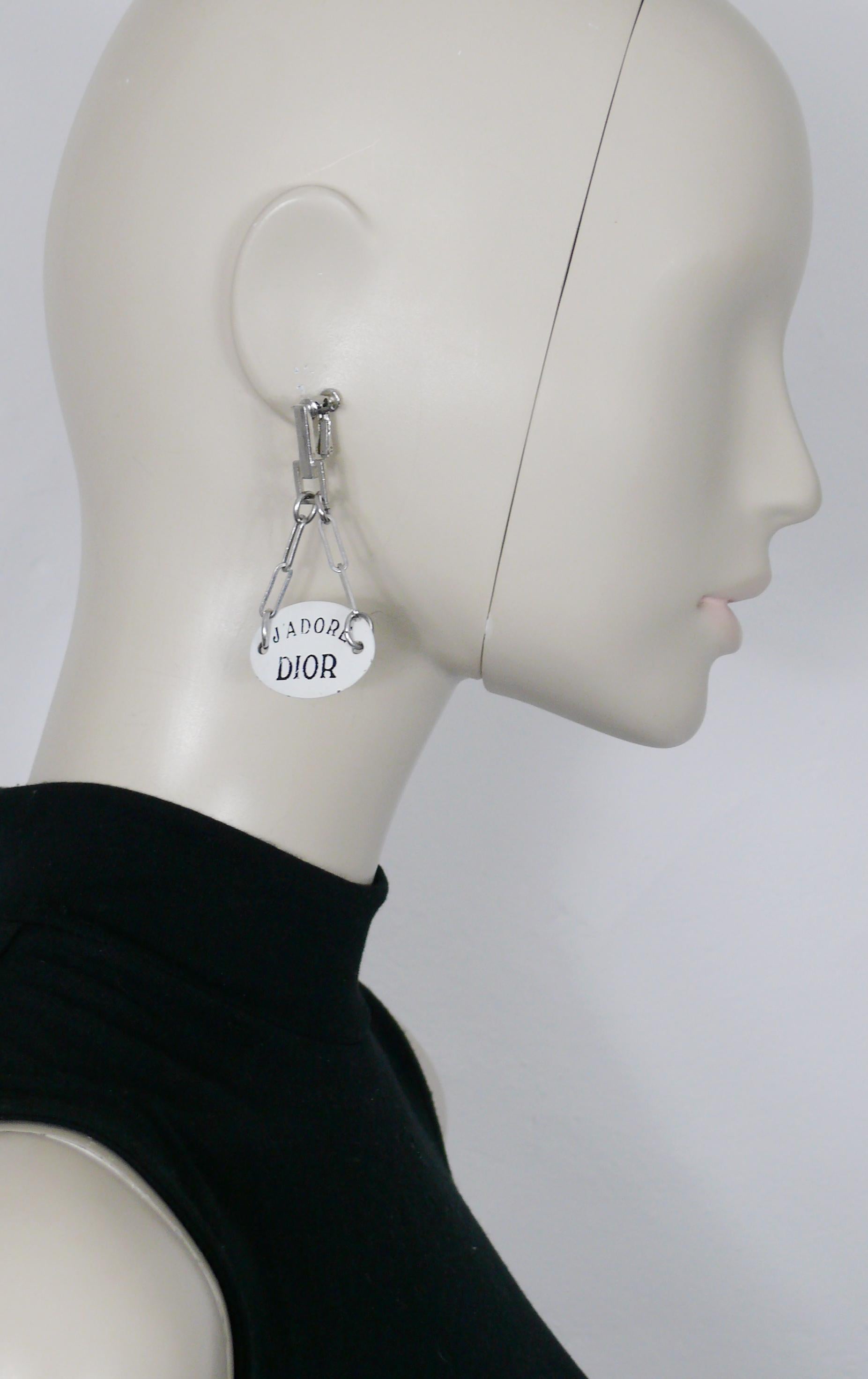 CHRISTIAN DIOR vintage dangling earrings (screw clip-on) featuring a large white enamel oval plate with black lettering 
