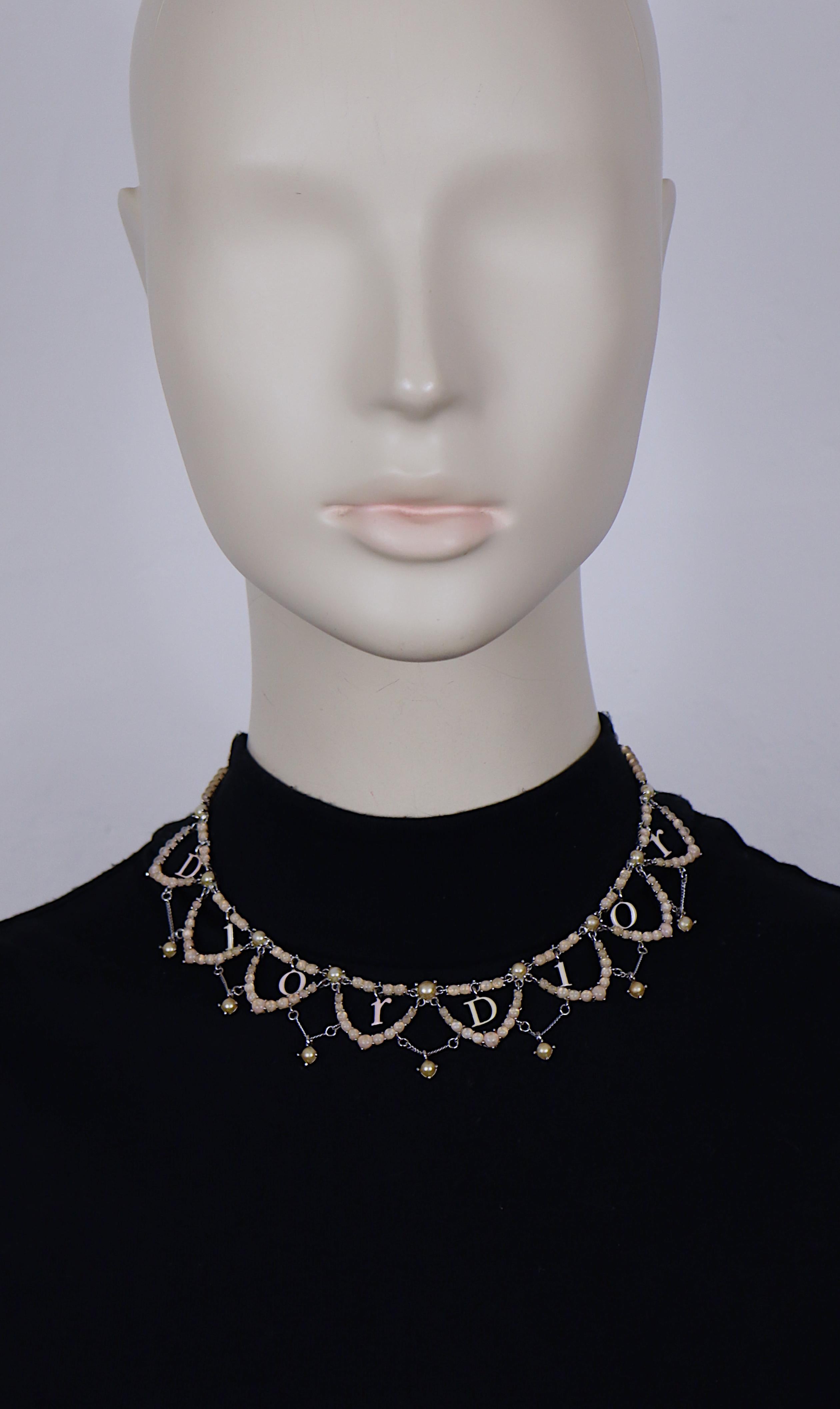 CHRISTIAN DIOR vintage silver tone necklace embellished with pink opalescent beads and faux pearls, featuring enameled dangling D I O R logos.

Lobster clasp closure.

Embossed DIOR.

Indicative measurements : length approx. 38 cm (14.96 inches) /