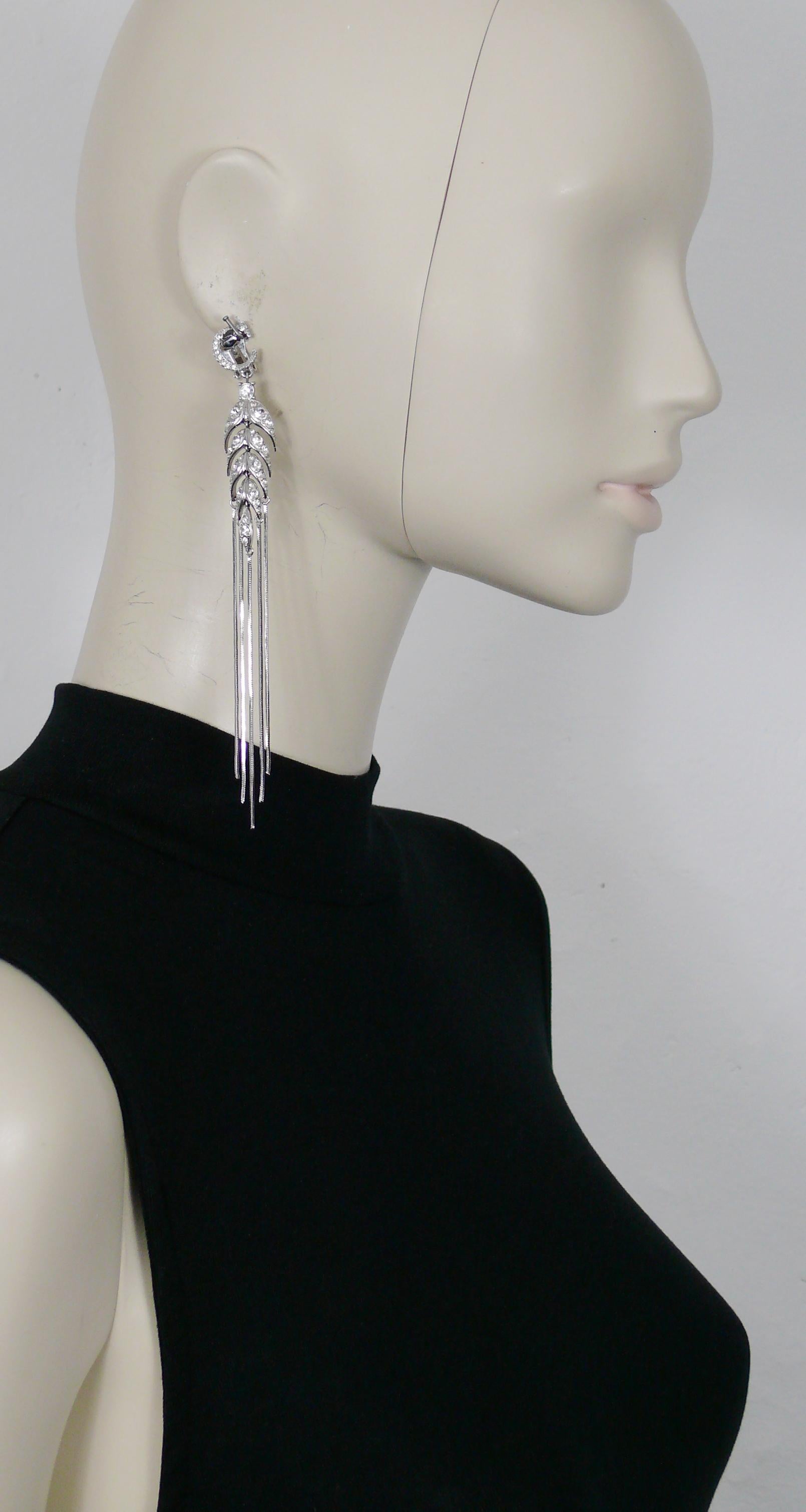 CHRISTIAN DIOR vintage silver toned dangling (clip-on) earrings featuring an articulated ear of wheat embellished with chains shower and clear crystals. One earring is topped by a C initial and the other by a D.

Silver tone metal