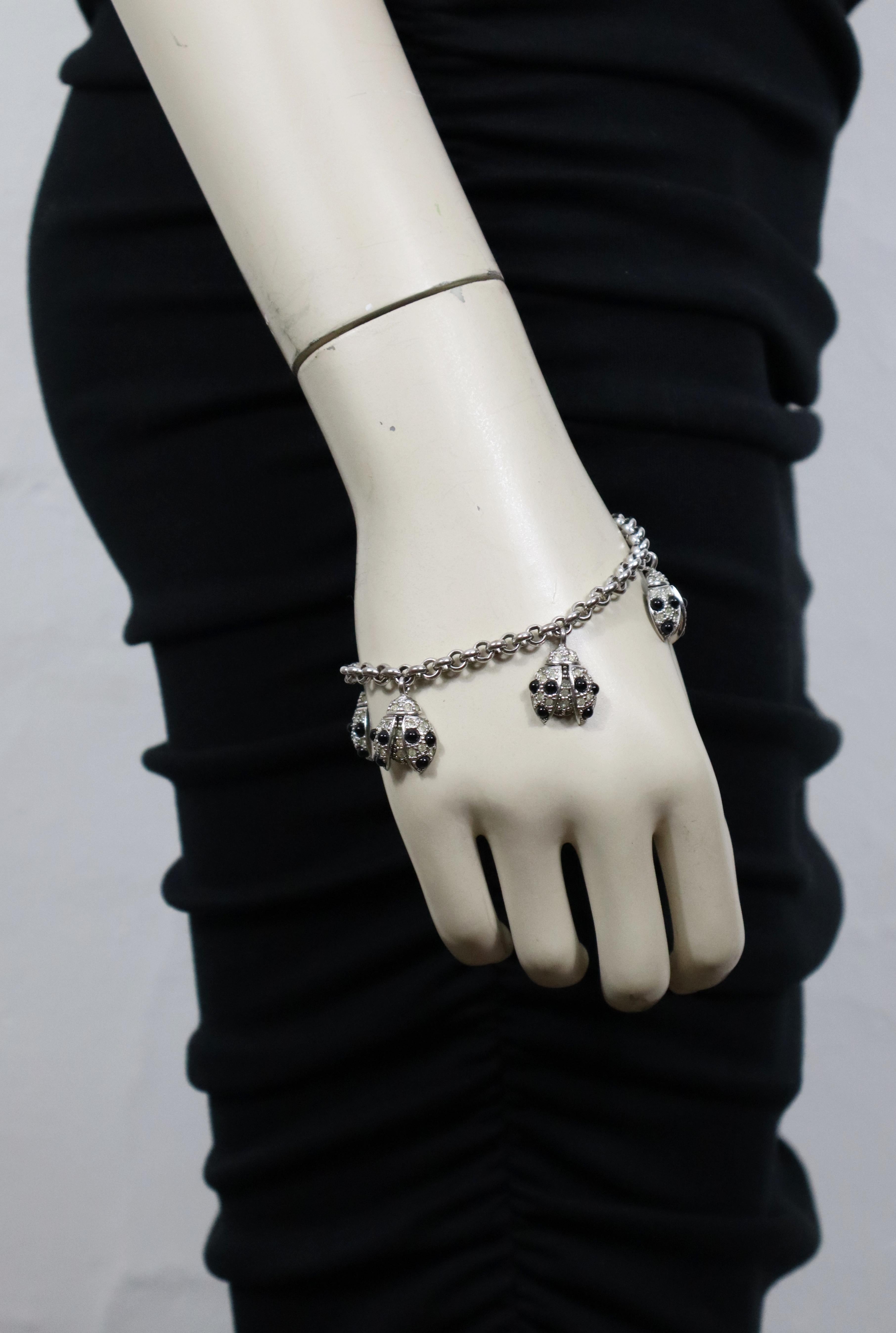 CHRISTIAN DIOR vintage silver tone chain bracelet featuring four ladybug charms embellished with clear crystals and black glass cabochons.

Embossed CHR. DIOR © Germany.

Indicative measurements : length approx. 20 cm (7.87 inches) / ladybug charm