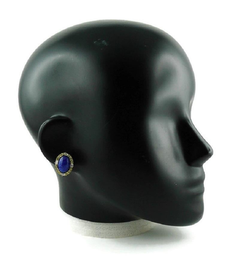 CHRISTIAN DIOR vintage gold toned clip-on earrings featuring a large glass lapis lazuli oval cabochon center adorned with clear crystals.

CHR. DIOR Germany.

Indicative measurements : height approx. 2 cm (0.79 inch) / width approx. 1.5 cm (0.59
