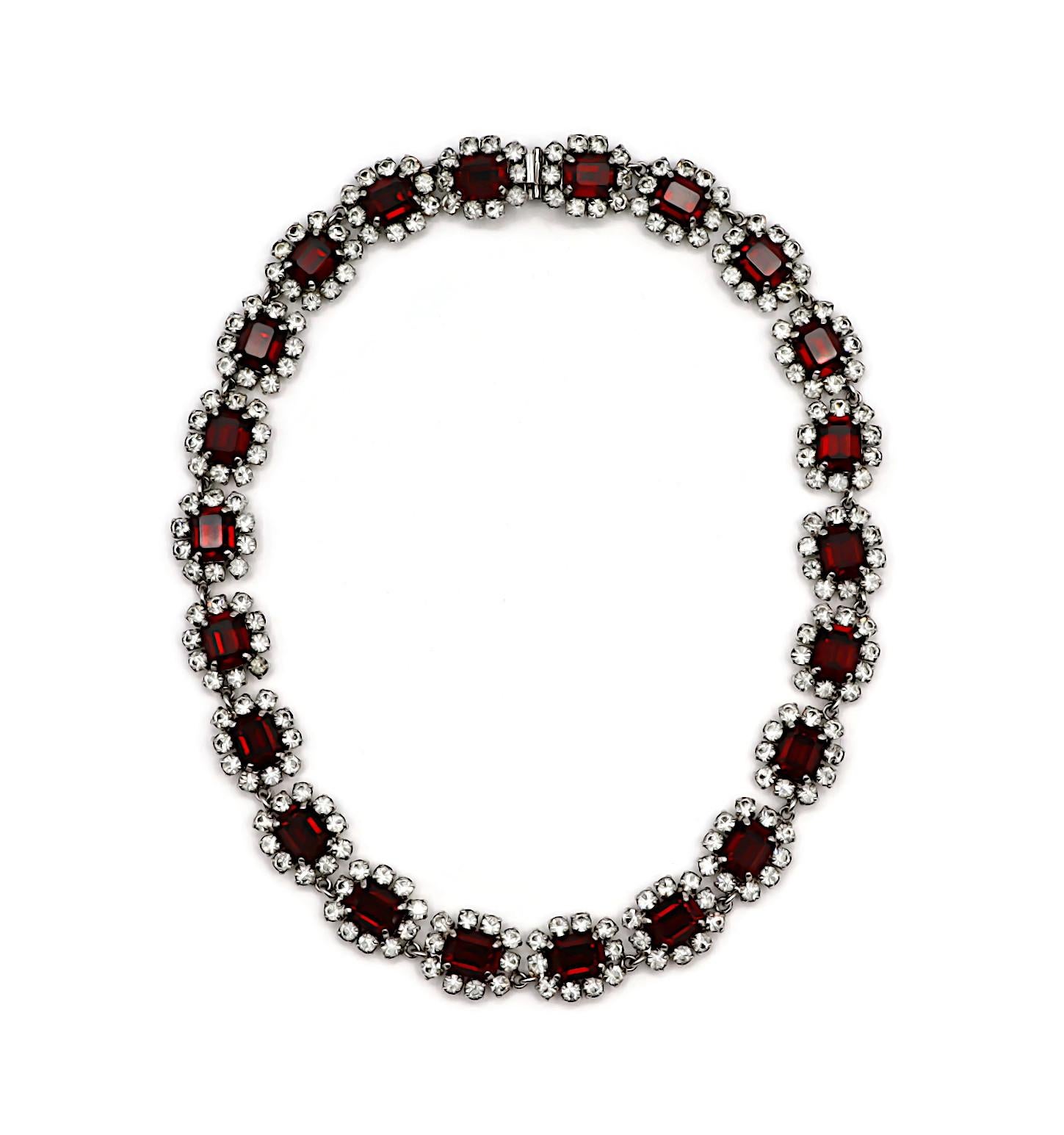 CHRISTIAN DIOR vintage silver tone necklace and clip-on earrings set embellished with rectangular ruby colour crystals adorned with clear crystals.

Embossed 1966 CHR. DIOR Germany.

NECKLACE
Indicative measurements : length approx. 42 cm (16.54