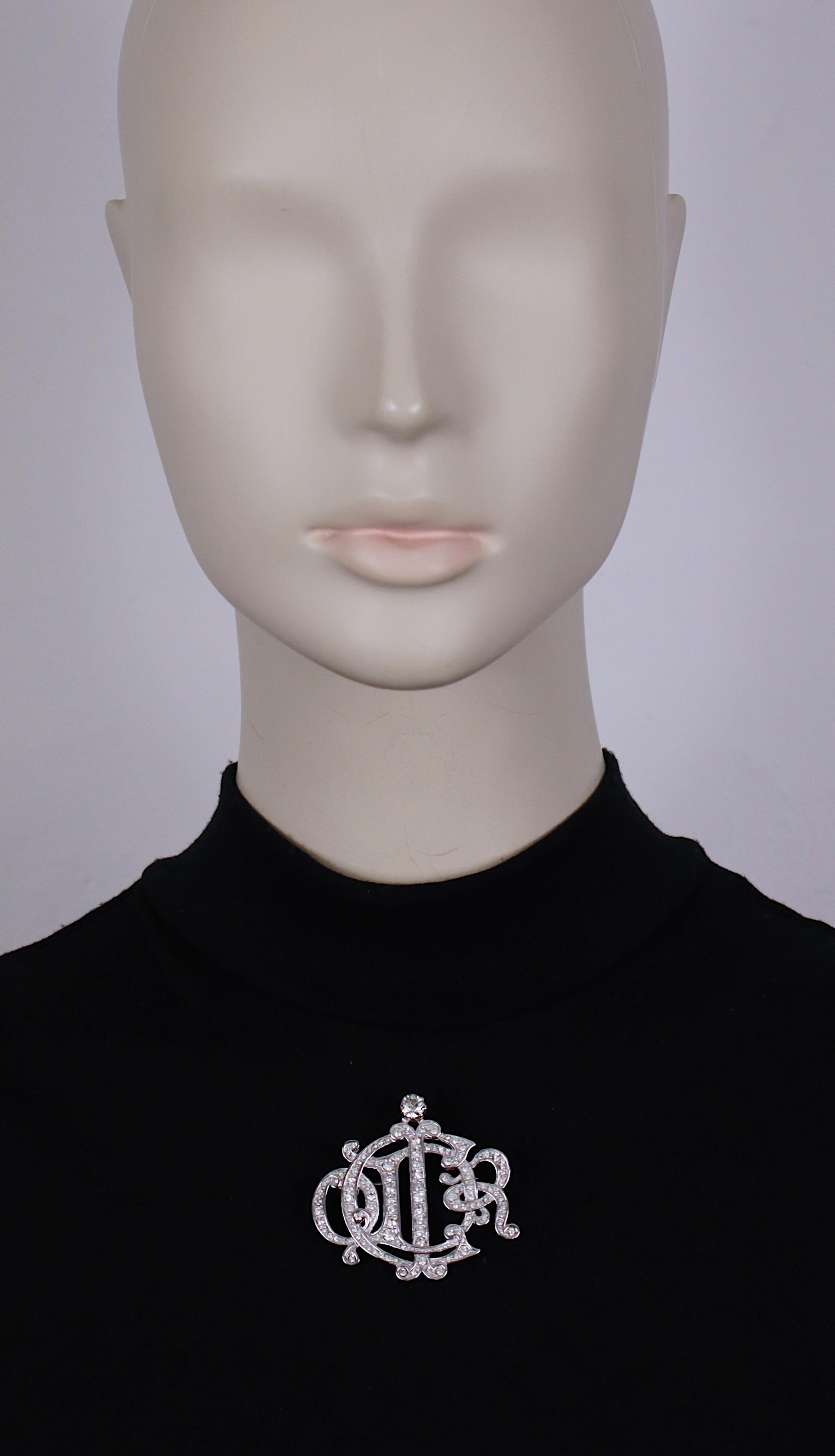 CHRISTIAN DIOR vintage silver tone brooch featuring C DIOR monogram logo embellished with clear crystals.

Embossed CHR. DIOR © Germany.

Indicative measurements : max. width approx. 4.6 cm (1.81 inches) / max. height approx. 4.5 cm (1.77