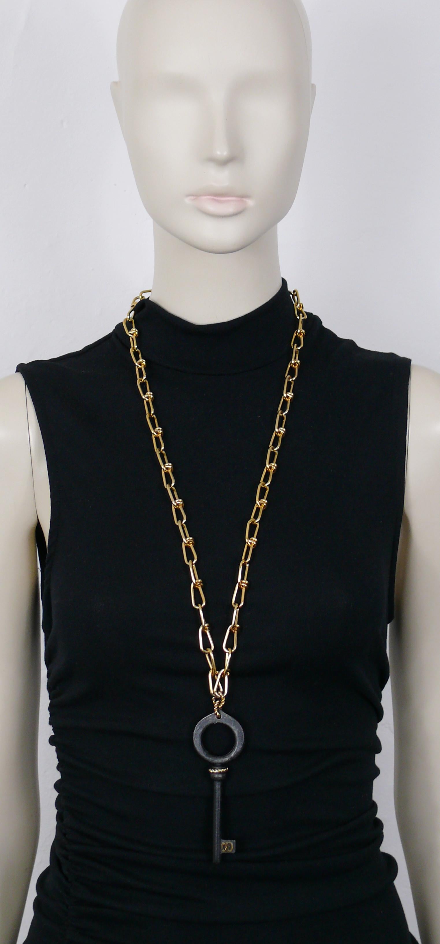 CHRISTIAN DIOR vintage rare gold toned chain necklace featuring a large distressed black patina key pendant with CD monogram.

Spring ring closure.

Embossed CHR. DIOR 1969 Germany.

Indicative measurements : chain length approx. 80 cm (31.50