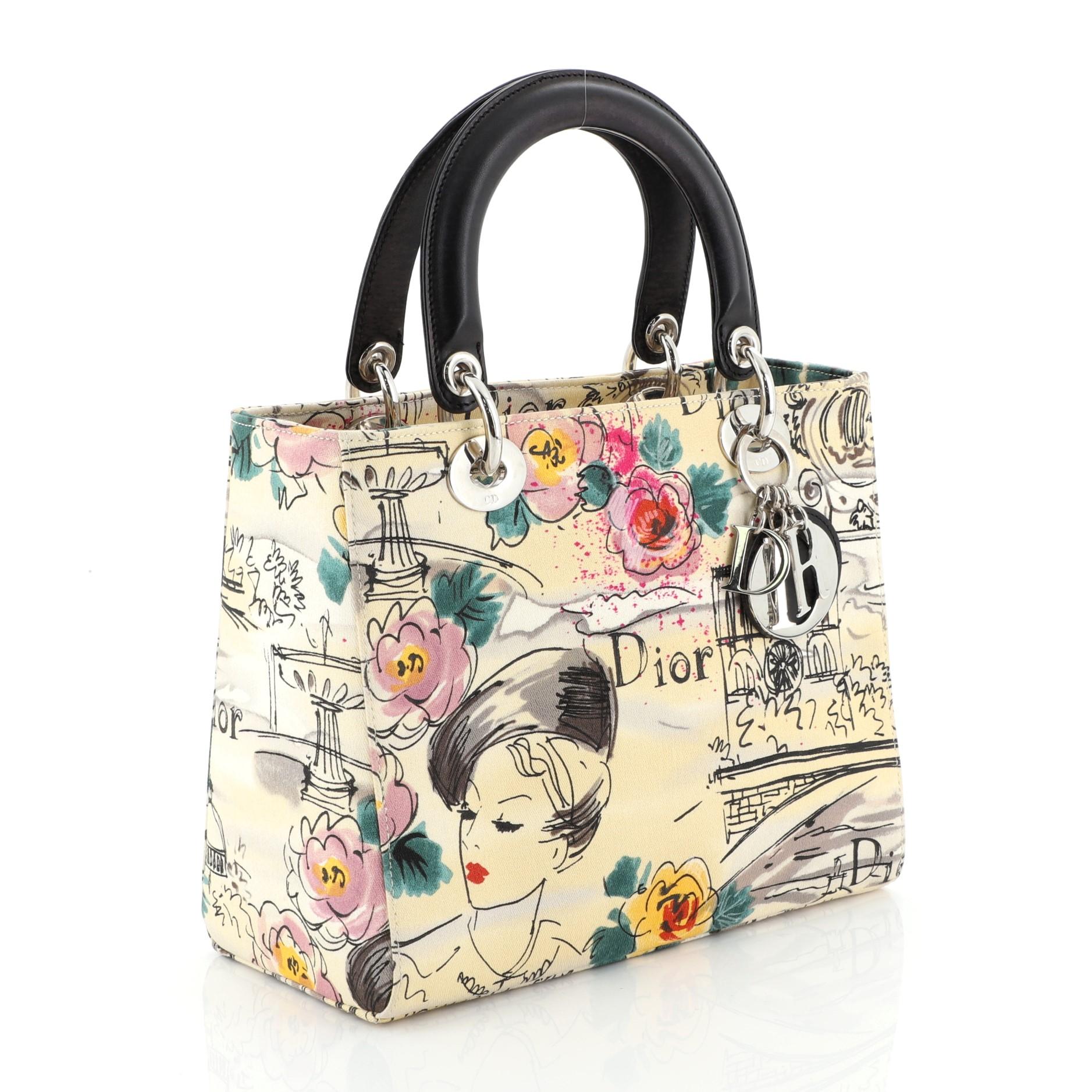 This Christian Dior Vintage Lady Dior Bag Printed Canvas Medium is a classic bag also known as the princess bag inspired by Princess Diana. Crafted from yellow printed canvas, it features dual top handles with Dior charms and silver-tone hardware.