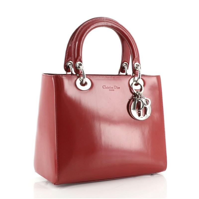 Condition: Good. Odor in interior. Scuffs, indentations and wear on exterior and strap, darkening on handles, scratches on hardware.
Accessories: With Strap
Measurements: Handle Drop 4