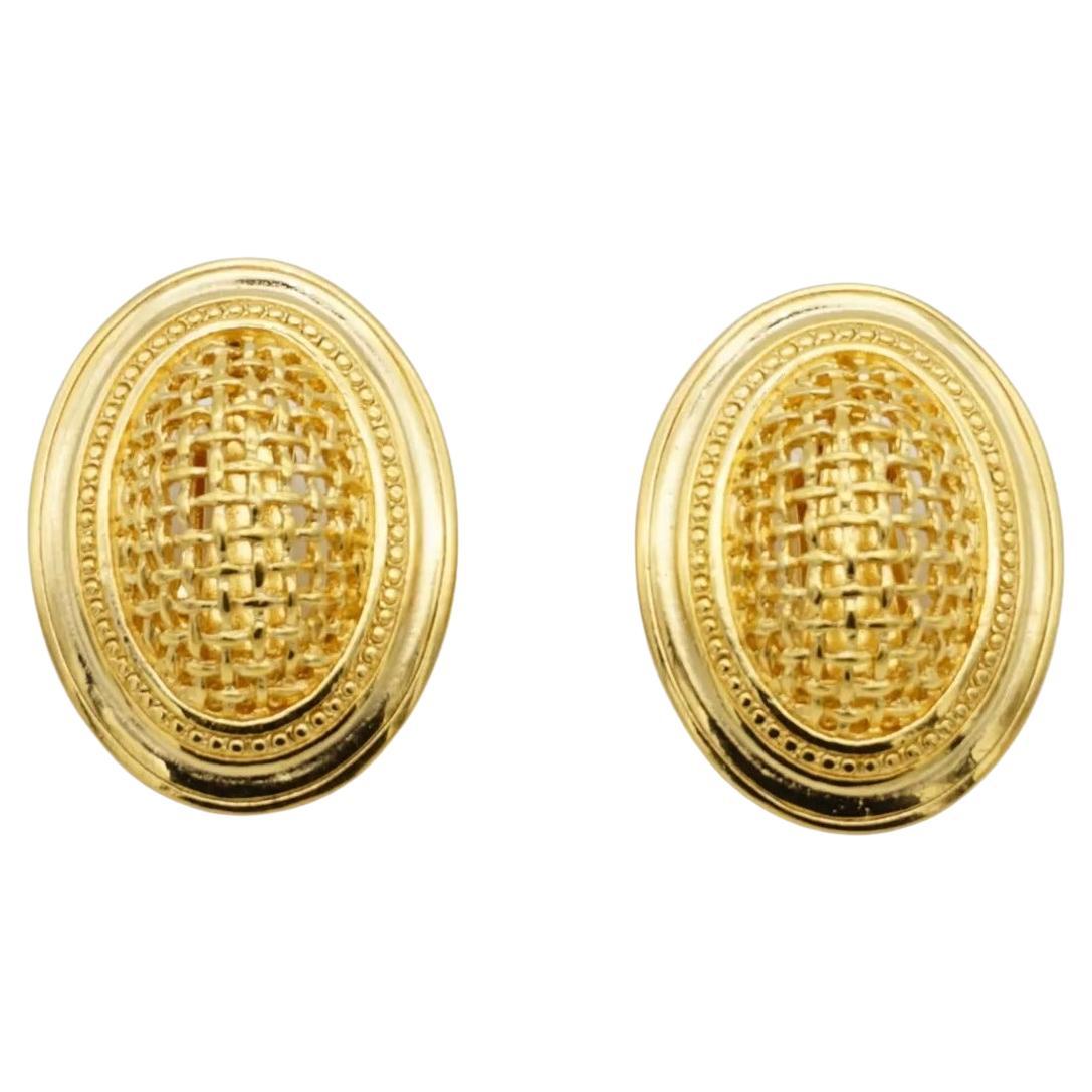 Christian Dior Vintage 1980s Unisex Large 3D Arch Oval Openwork Mesh Dome Chunky Statement Modernist Clip Earrings, Gold Tone

Very good condition. Very light scratches or colour loss, barely noticeable. 100% Genuine.

Signed at the back. Rare to
