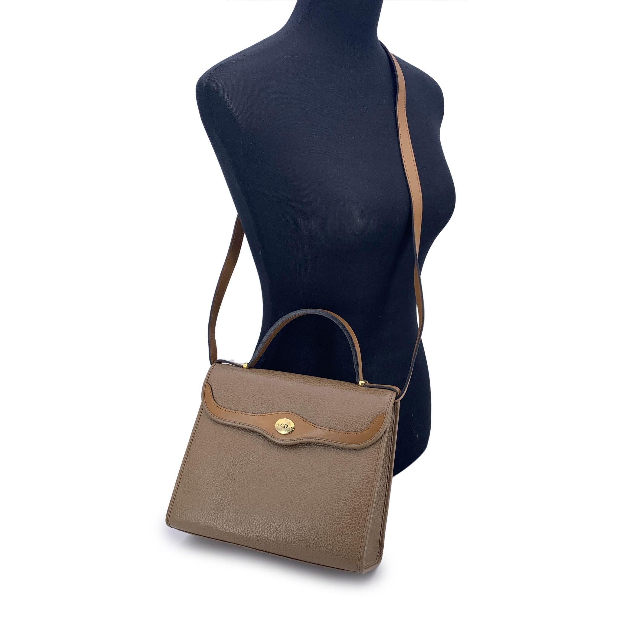 With its elegant trapeze silhouette and warm light brown leather, this vintage Christian Dior handbag is a true gem for collectors who adore the quiet sophistication of classic Dior. Designed to offer both structure and versatility, it's a timeless