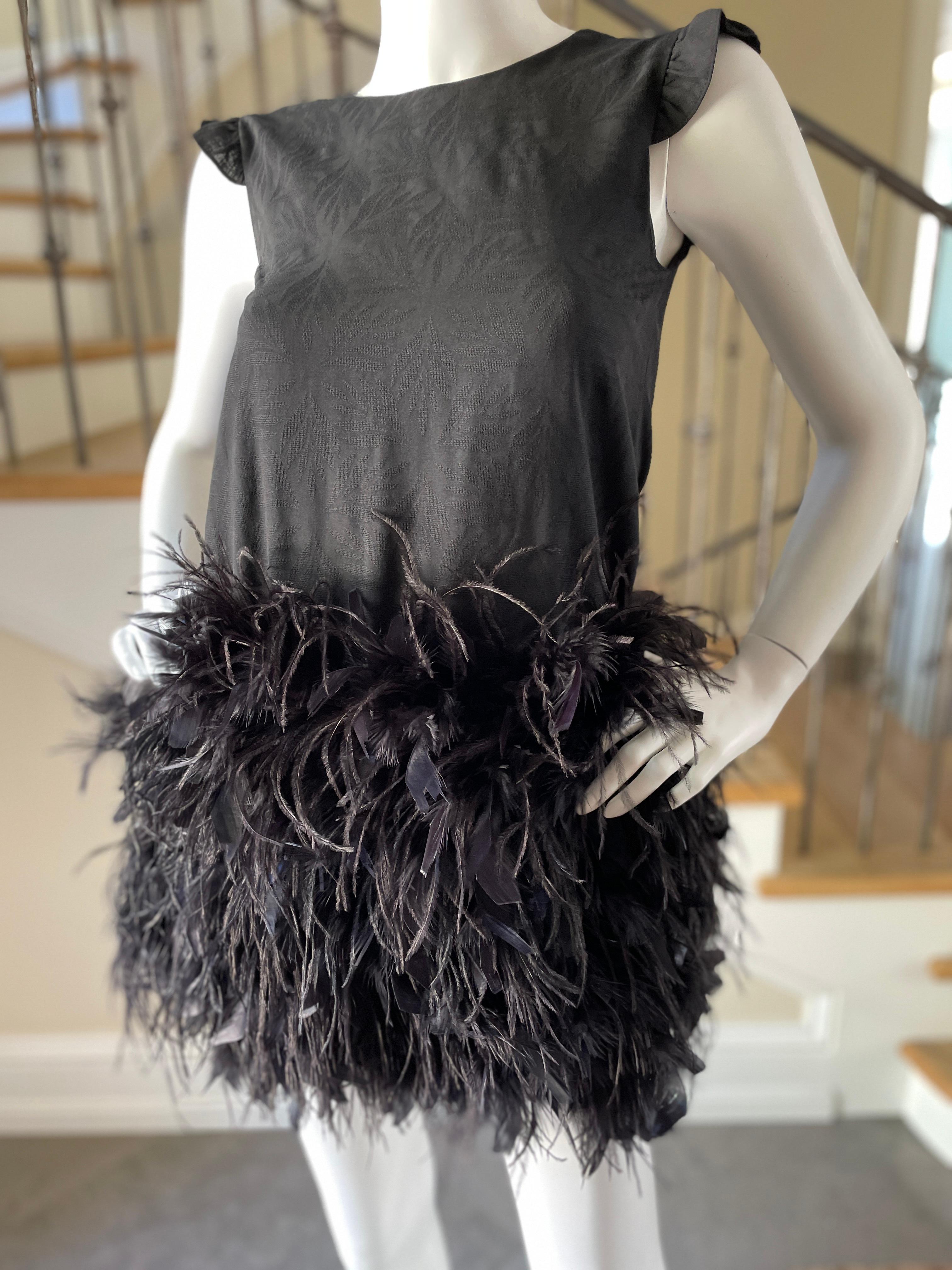 Christian Dior Vintage Little Black Cocktail Dress with Festive Feather Skirt.
This is so pretty, silk blend lined in pure silk with turkey and ostrich feather skirt.
I think it is from the 80's, from the Japanese market, it is marked size 12, which