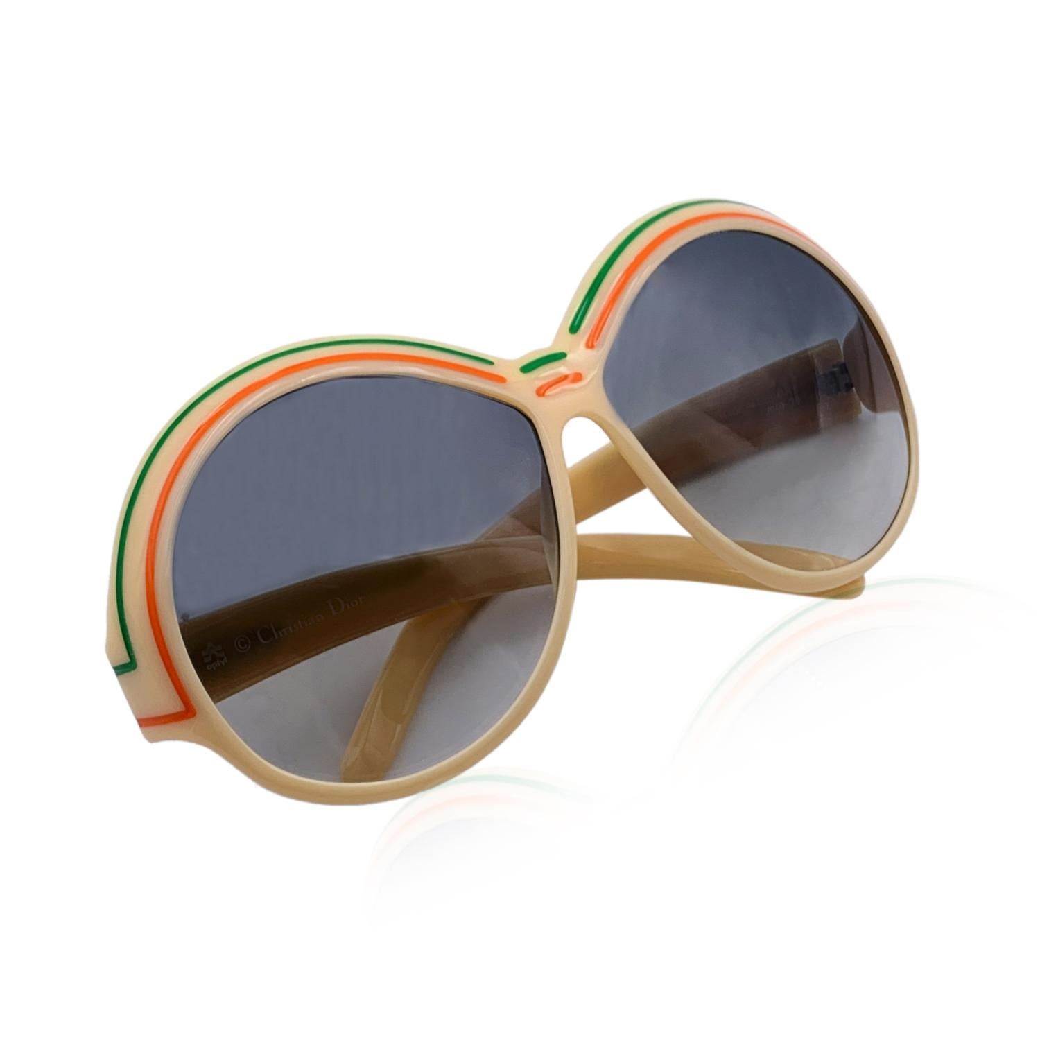 Vintage Christian Dior oversize sunglasses, Mod. 2040 - Col 70. Beige Optyl frame with green and orange striped detailing. Original 100% Total UVA/UVB protection in gradient grey color. CD logo on temples. Made in Germany

Details

MATERIAL: