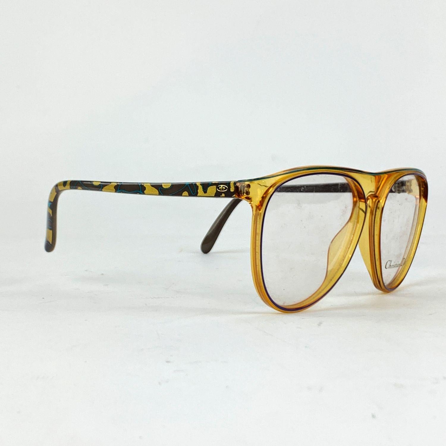 Vintage Eyeglasses by Christian Dior Mod. 2293, from the 90s. Made in Austria. Beige clear Optyl frame with grey camouflage ear stems. Clear DEMO lens, with Christian Dior signature. Model refs: Mod. 2293 - 50 - 57/13 - 125



Details

MATERIAL: