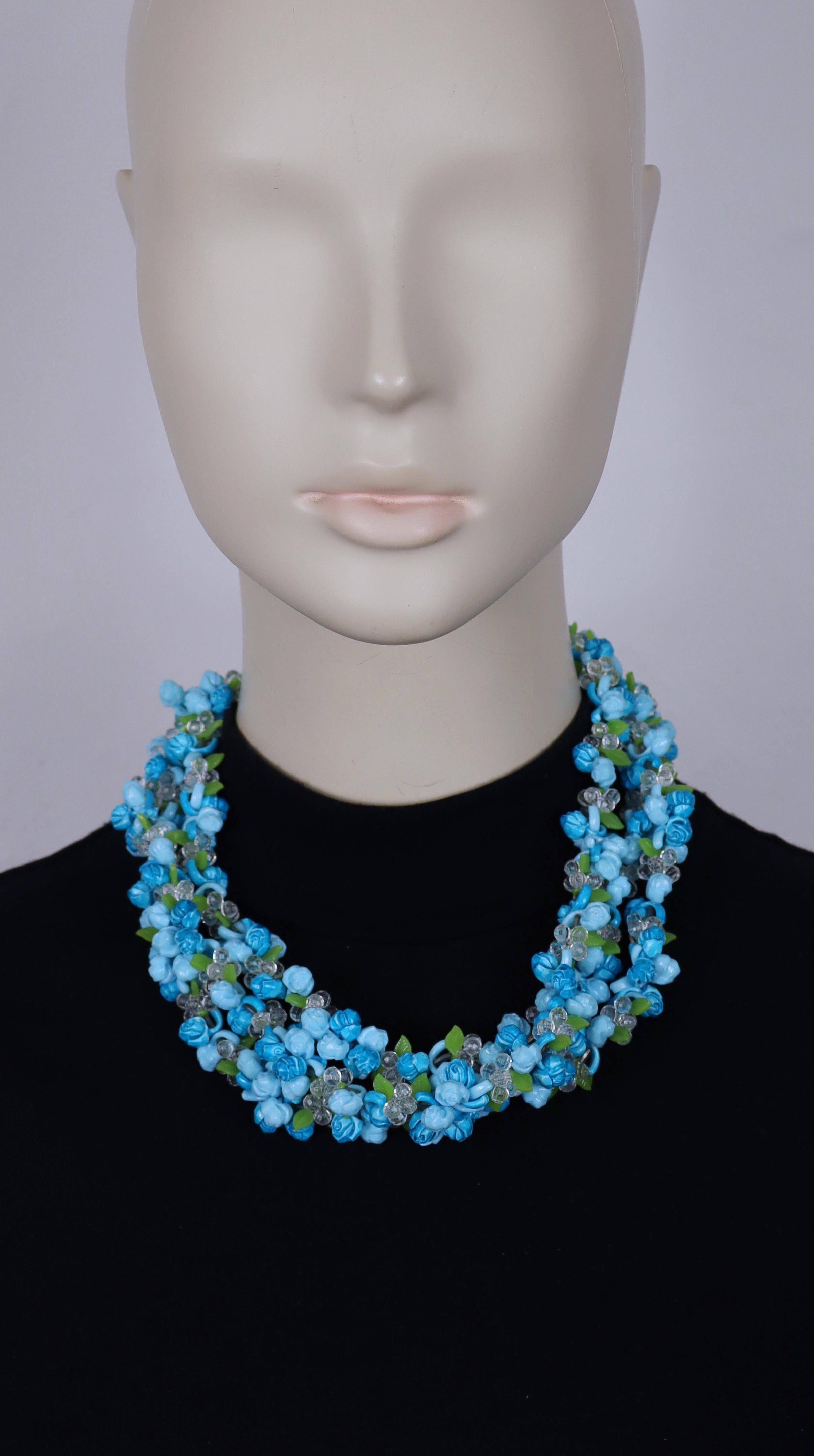 CHRISTIAN DIOR vintage multi-strand necklace featuring blue shade resin roses, faceted clear beads and green leaves.

Round box clasp.

Embossed 19 CHR. DIOR 66 Germany.

Indicative measurements : length approx. 49 cm (19.29 inches) / max. width