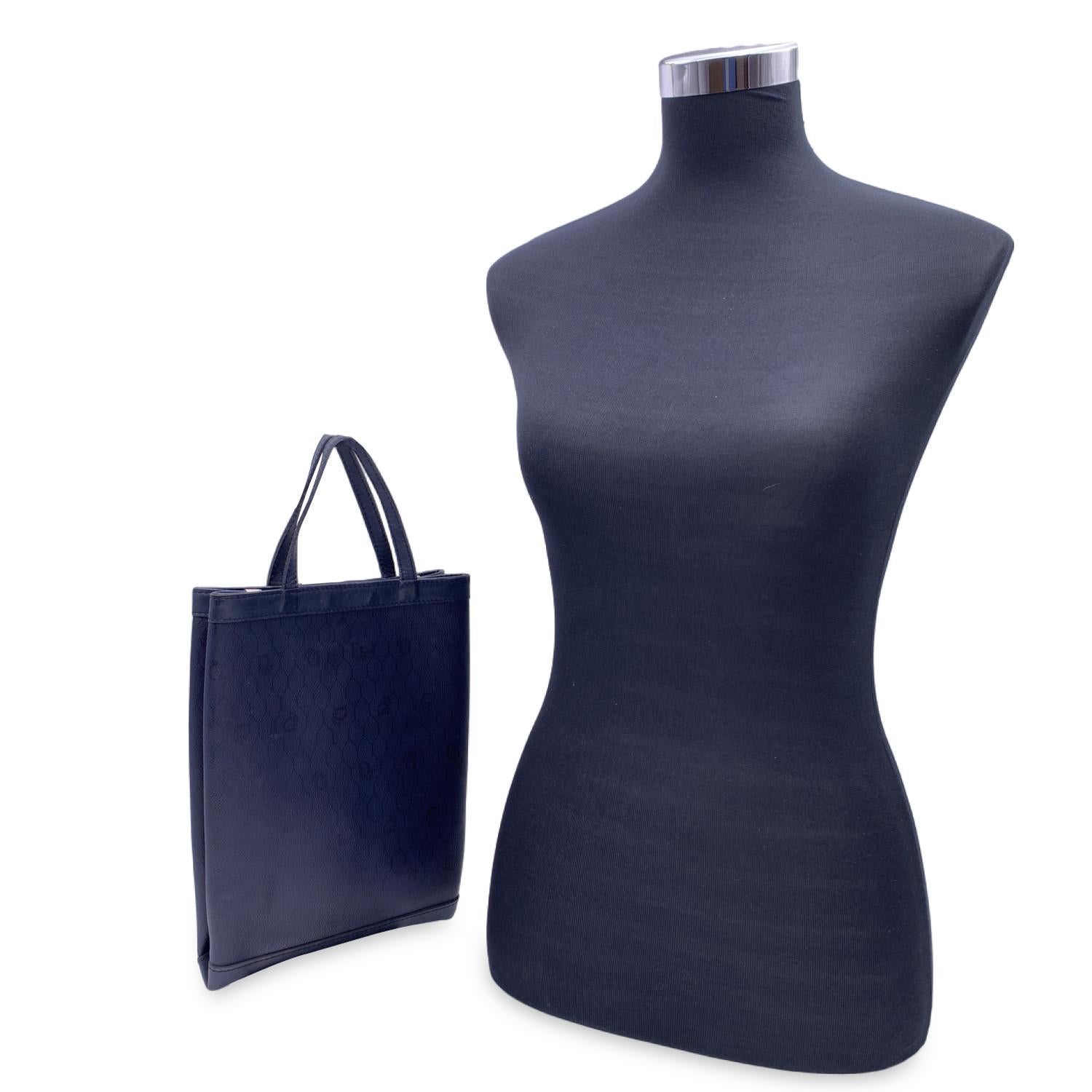 Vintage CHRISTIAN DIOR small tote bag crafted in blue logo canvas with genuine leather trim. Magnetic button closure on top. Blue fabric lining. 'Christian Dior - Made in france' embossed inside.


Condition

A - EXCELLENT

Gently used. Minimal wear