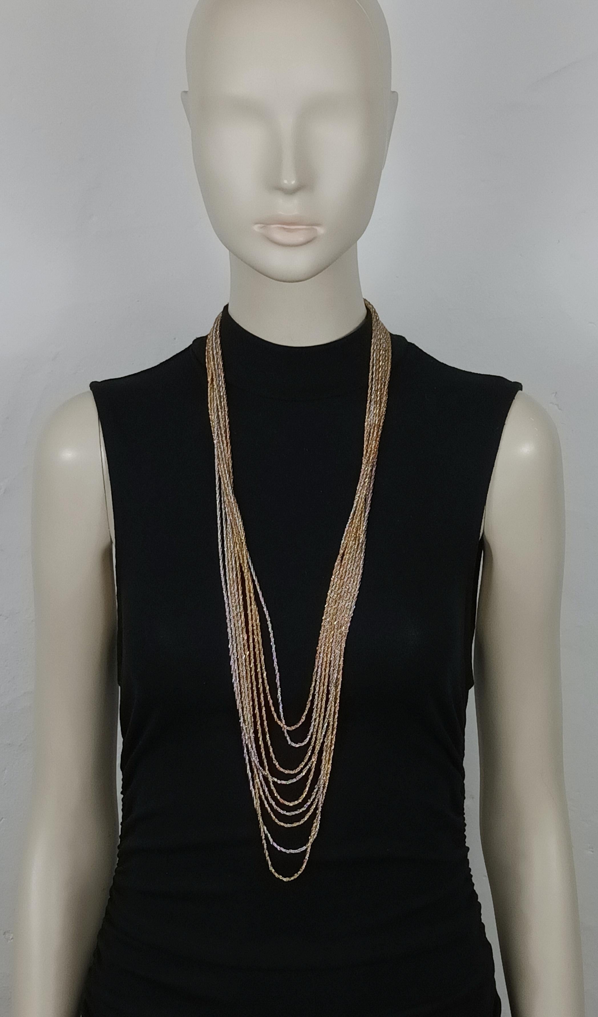CHRISTIAN DIOR vintage two tone necklace featuring nine strands of twisted mesh chains.

Spring clasp closure.

Embossed 19 CHR. DIOR © 73 Germany.

Indicative measurements : length approx. 80 cm (31.50 inches).

Material : Gold tone metal hardware