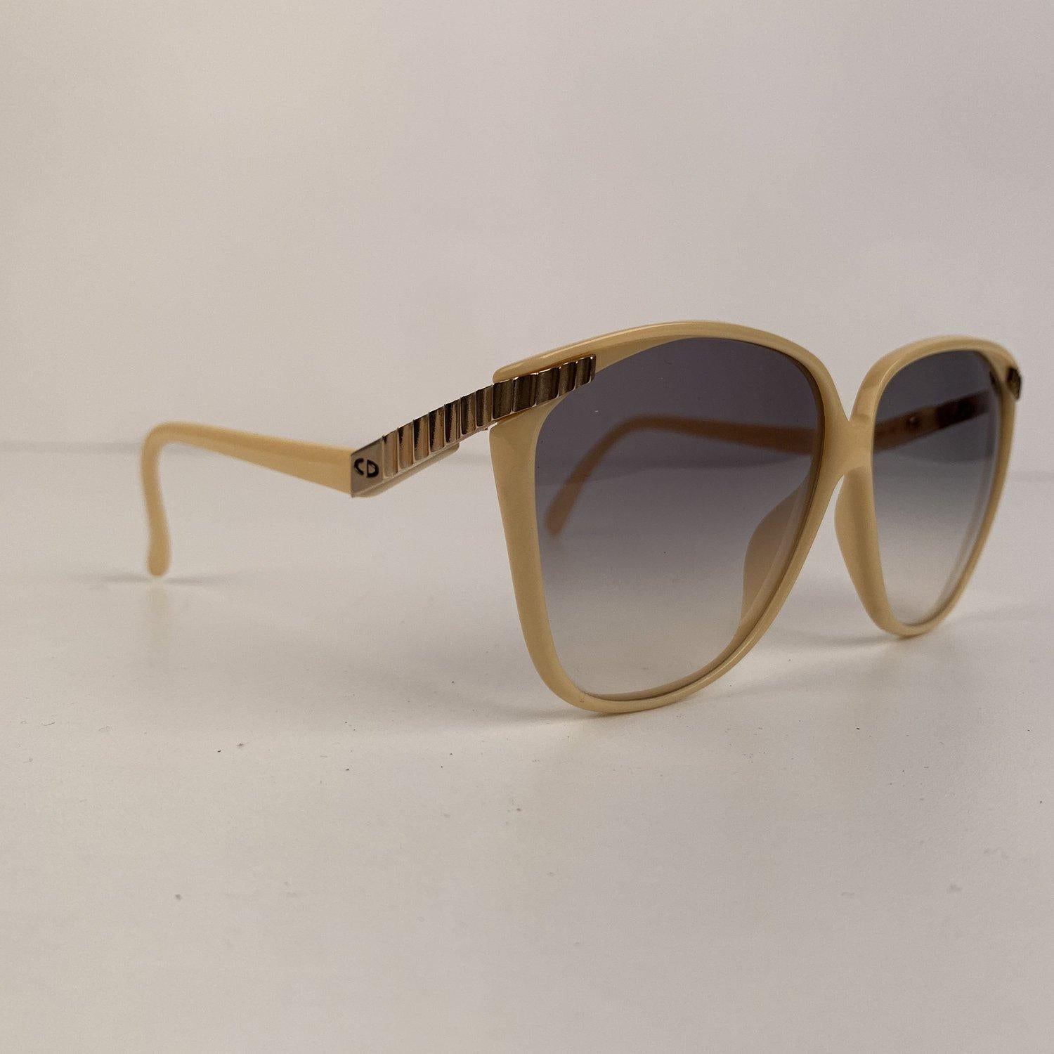 Original vintage oversized sunglasses from the late early 1980s. Frame made in France. Beige frame with gold metal finish on the top front and sides and 