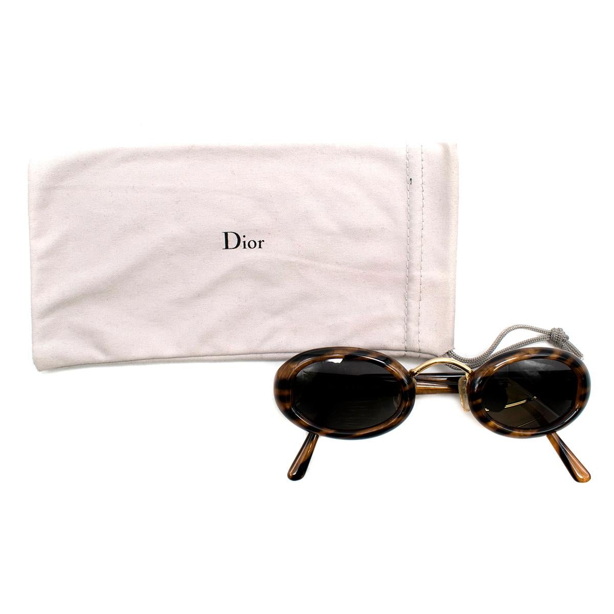 Christian Dior Vintage Oval Frame Sunglasses 

- Vintage Oval Havana Sunglasses
- Gold-toned metal bridge 
- Elegant brand initial motif to arms, gold toned
- UV lenses 
- This item comes with a dust bag. 

Please note, these items are pre-owned and