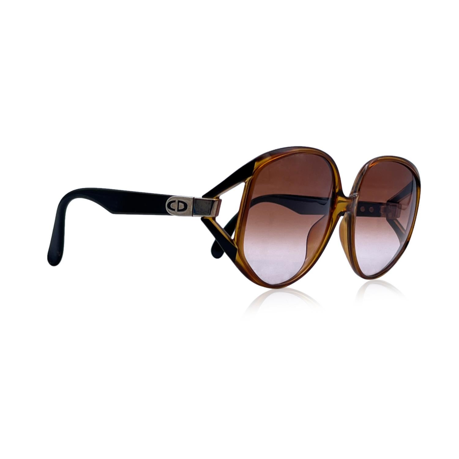 CHRISTIAN DIOR Vintage 1980s sunglasses, mod. 2320. Brown Optyl frame with black ear stems. Oversized design. Brown gradient lenses. Handmade in Germany. CD logo on temples. Mod. & Refs: 2320 - 10 - 62/16

Details

MATERIAL: Acetate

COLOR: